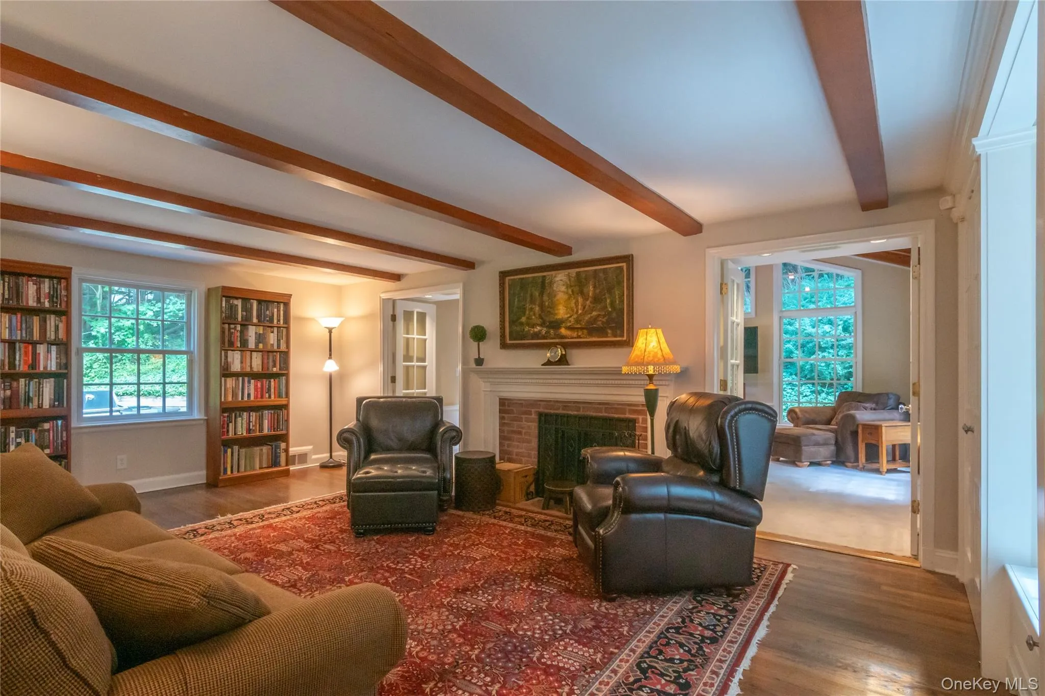 Living Room with Beamed Ceiling and Fireplace Living Room with Beamed Ceiling and Fireplace