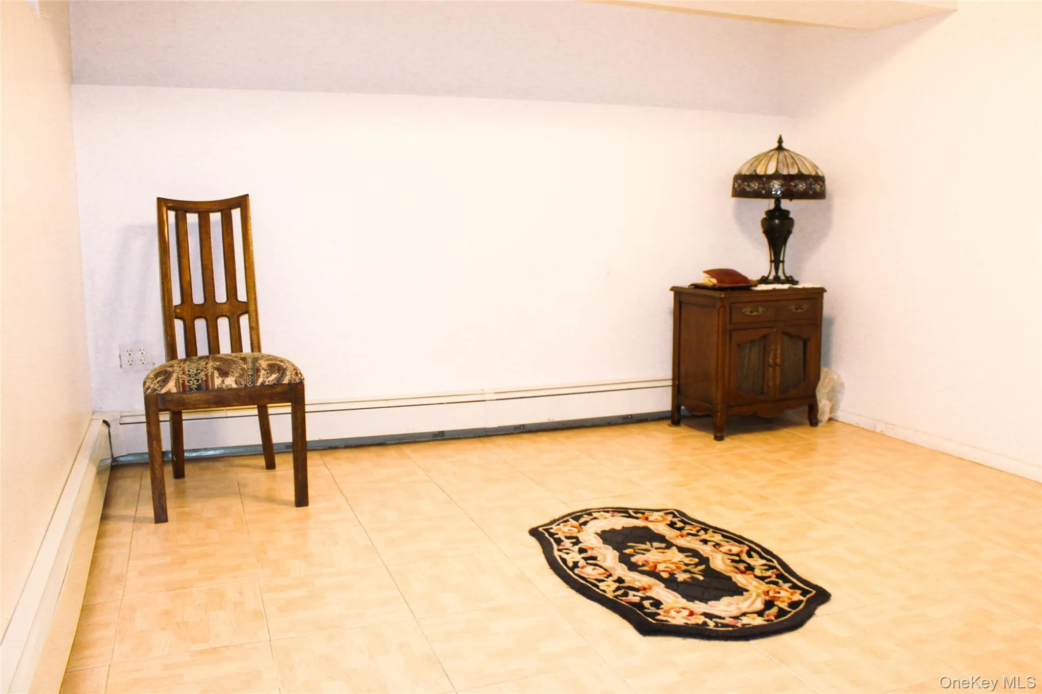 Recessed lighting illuminating a spacious room with hard-surface flooring and closet Recessed lighting illuminating a spacious room with hard-surface flooring and closet