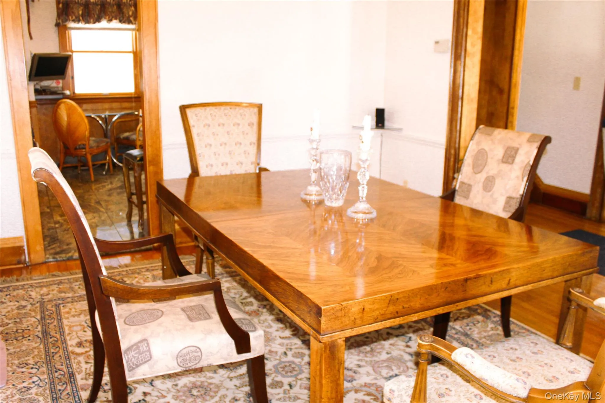 Formal Dining Room with Hardwood flooring, and wood trim accents Formal Dining Room with Hardwood flooring, and wood trim accents
