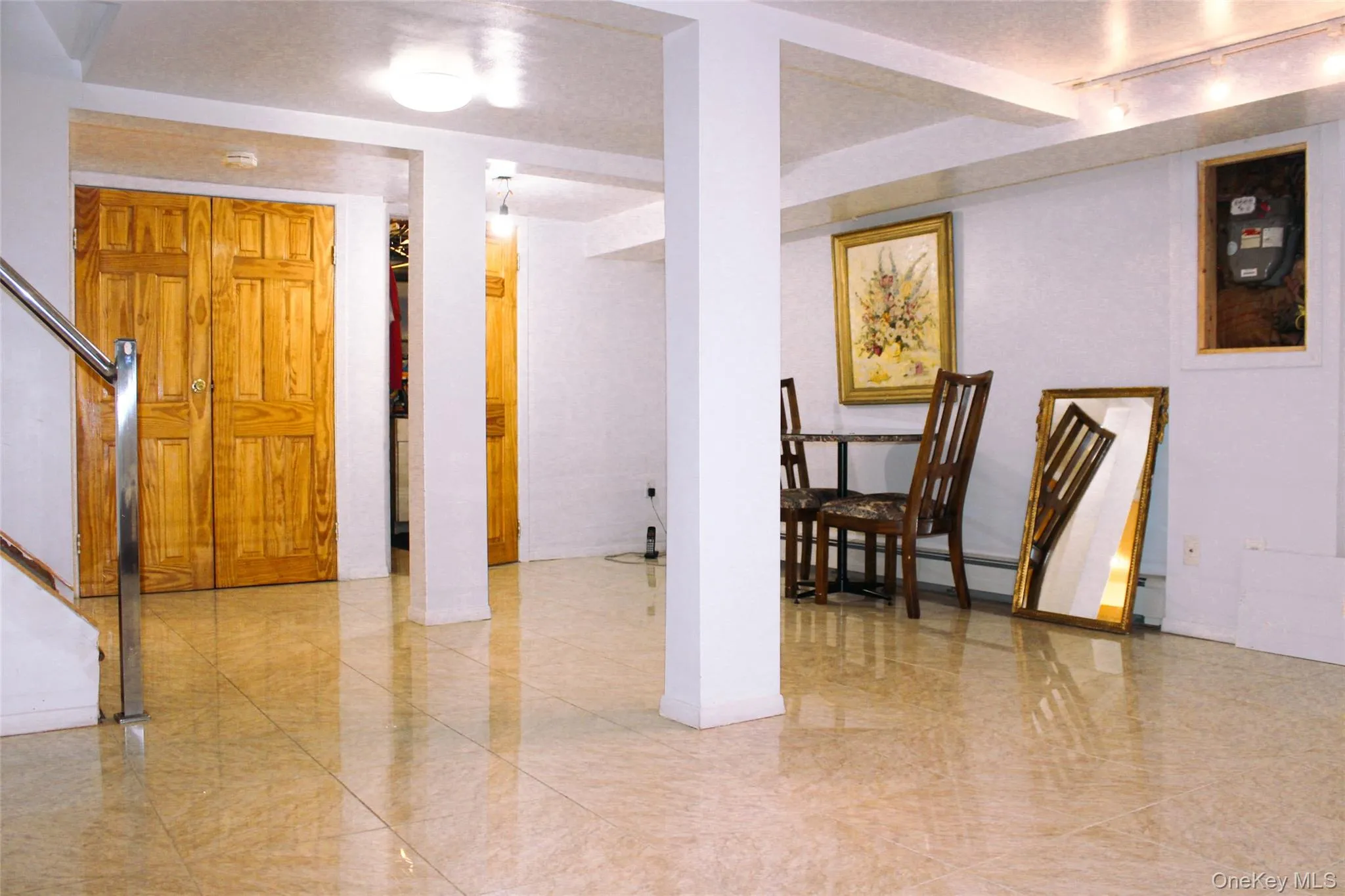 Light-toned tile flooring throughout basement Light-toned tile flooring throughout basement