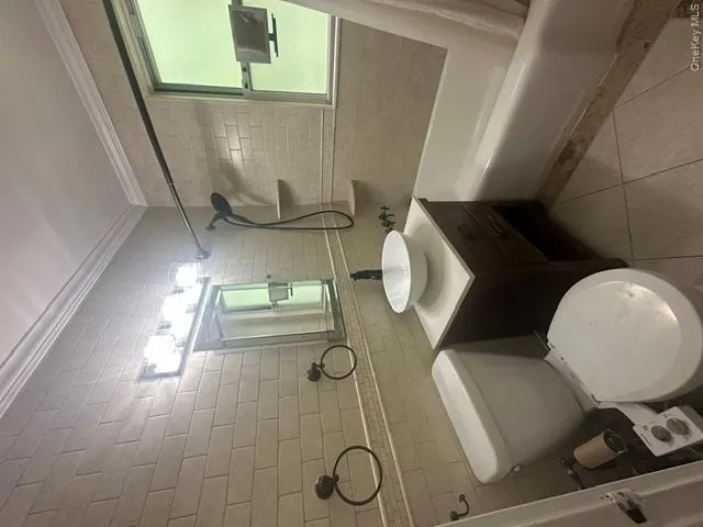 crown molding, granite counter and ceramic tile floor crown molding, granite counter and ceramic tile floor