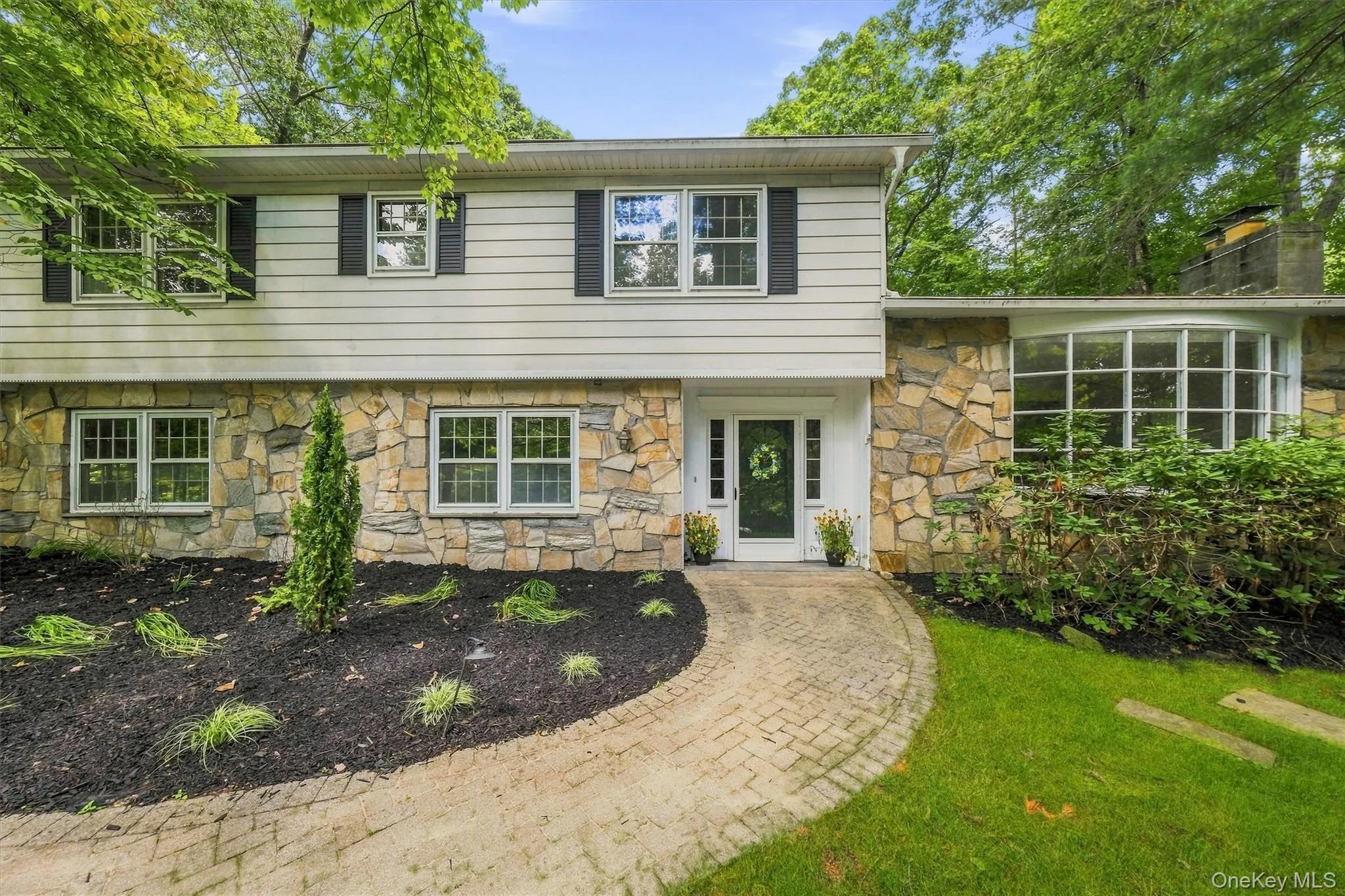Stone front with large bow window Stone front with large bow window