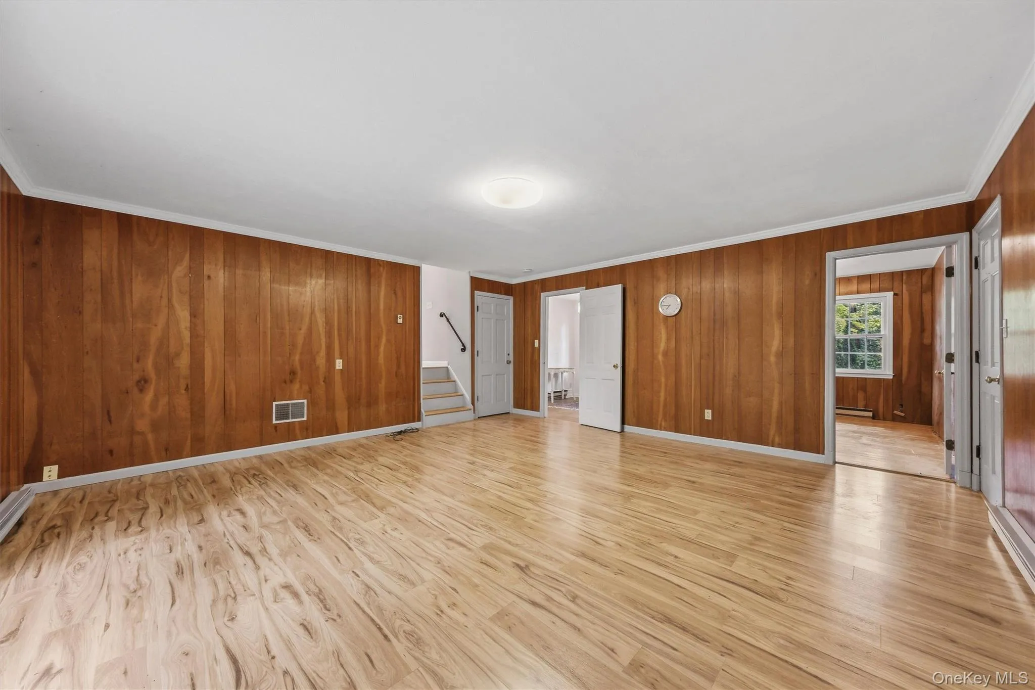 Enormous family room with new laminate floors and SGD to private backyard and patio Enormous family room with new laminate floors and SGD to private backyard and patio