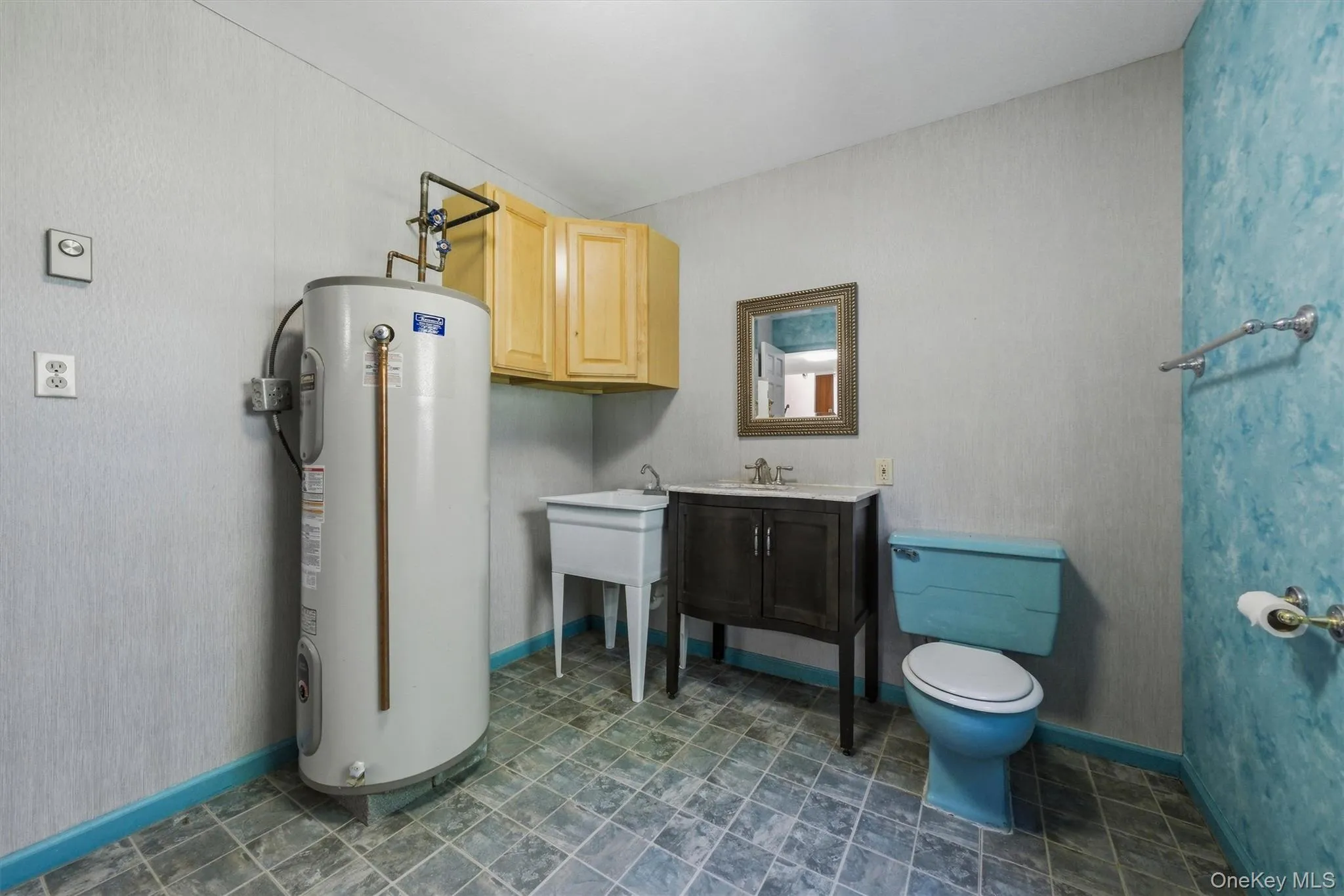 Laundry room with half bath and laundry tub Laundry room with half bath and laundry tub