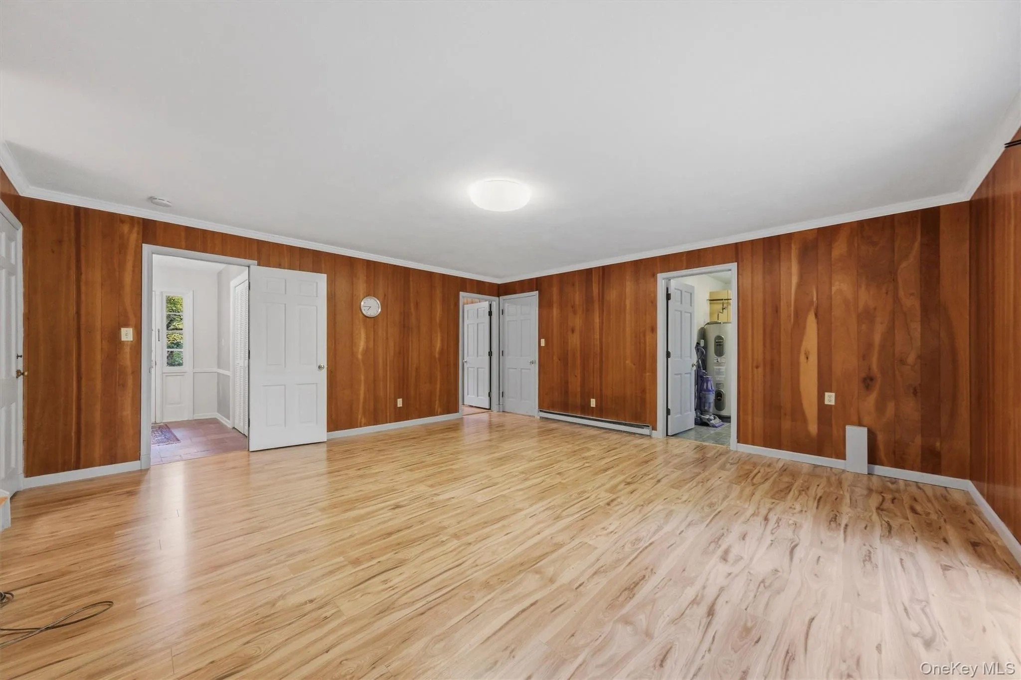 Enormous family room with new laminate floors and SGD to private backyard and patio Enormous family room with new laminate floors and SGD to private backyard and patio