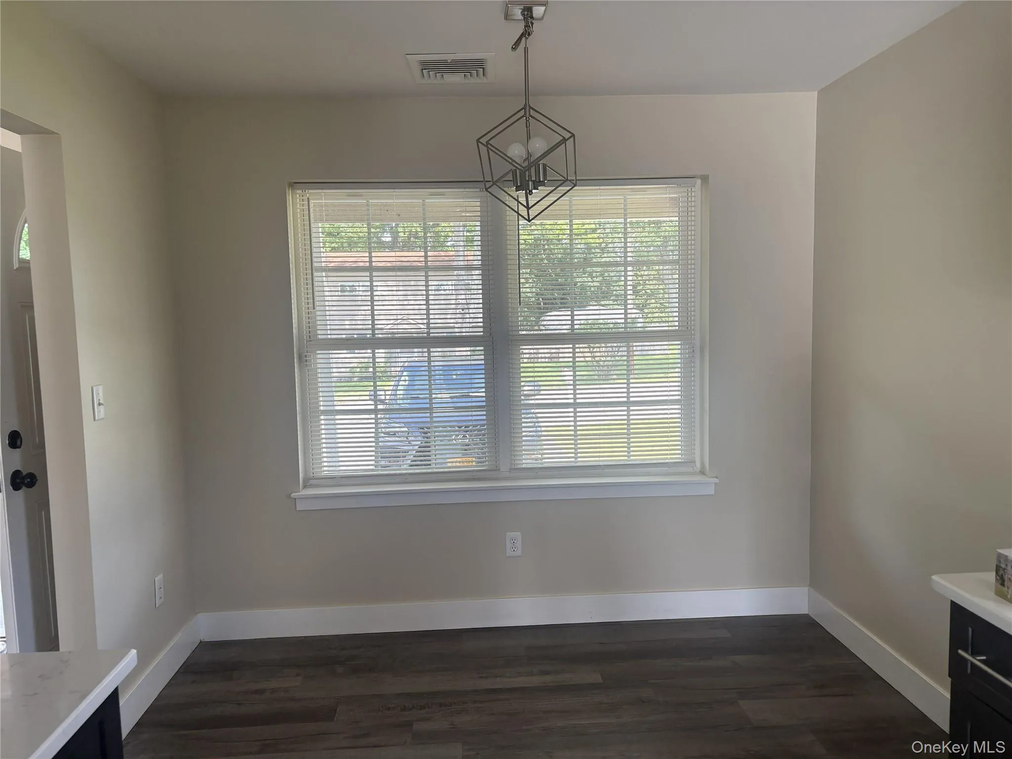 Neutral-toned walls with wood-finish flooring Neutral-toned walls with wood-finish flooring