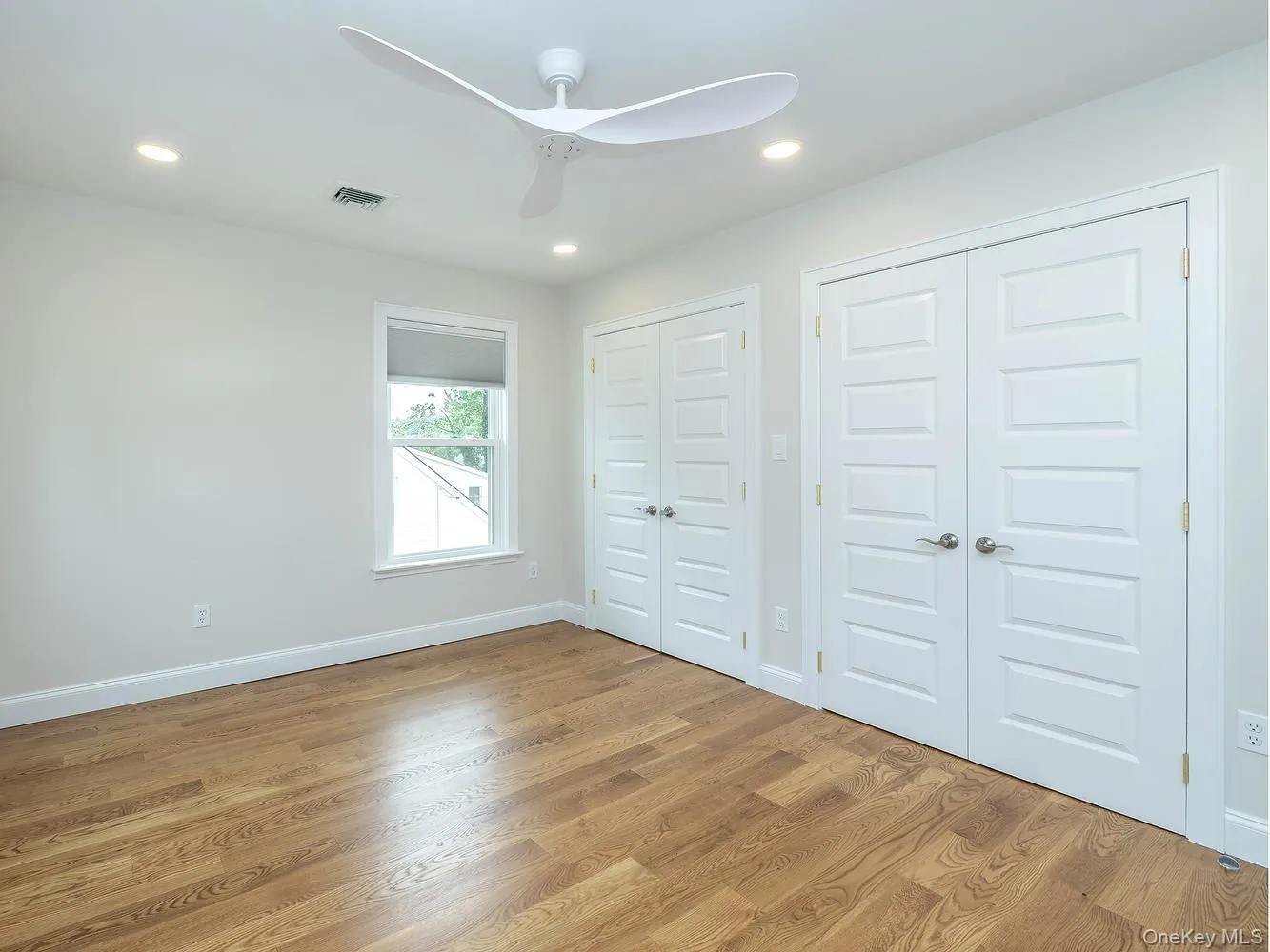 Second bedroom on 2nd floor with double walk-in closets. Second bedroom on 2nd floor with double walk-in closets.