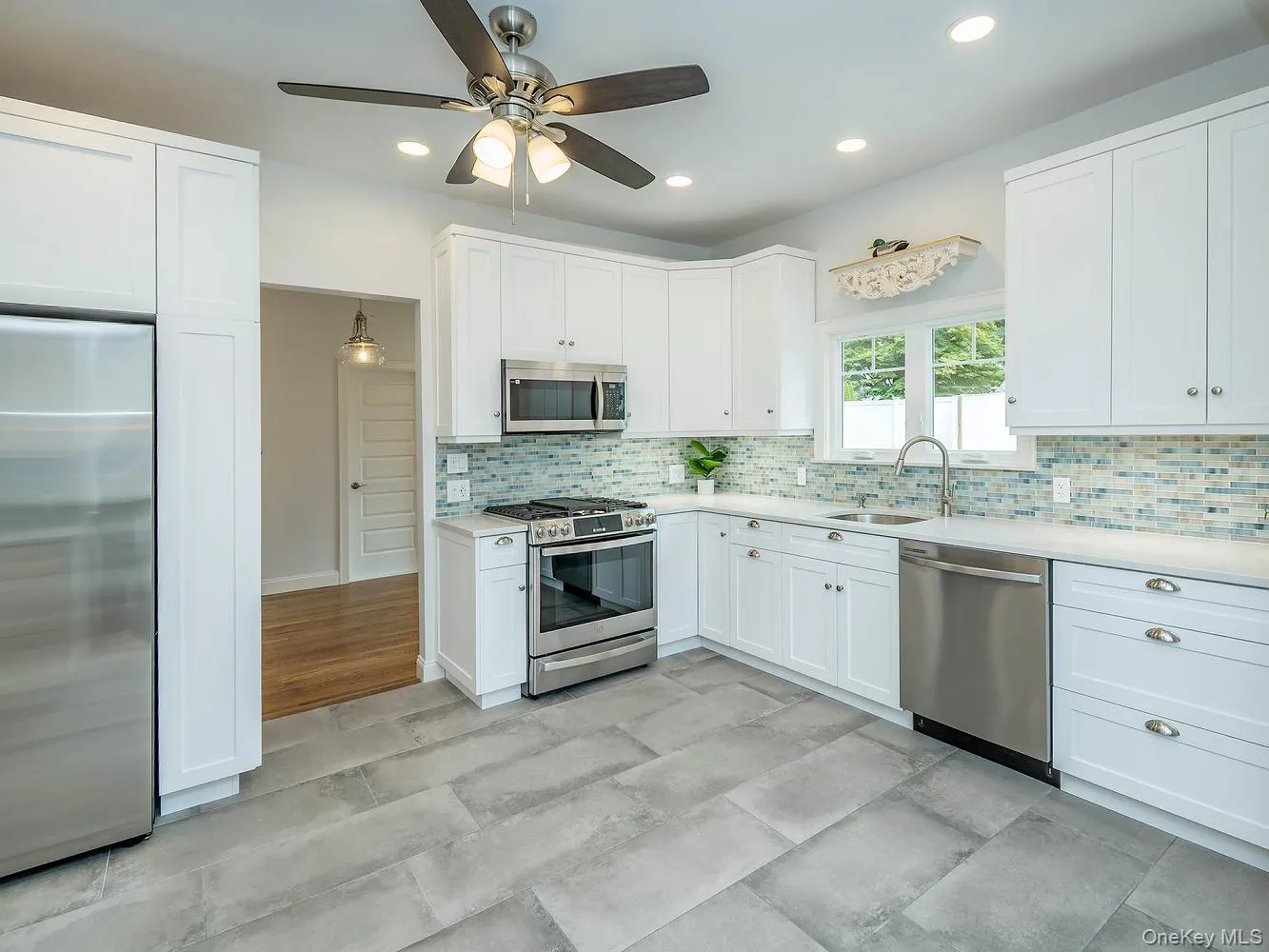 The beautifully renovated eat-in kitchen features modern finishes, new appliances, and a bright, functional layout designed for everyday living and entertaining. The beautifully renovated eat-in kitchen features modern finishes, new appliances, and a bright, functional layout designed for everyday living and entertaining.