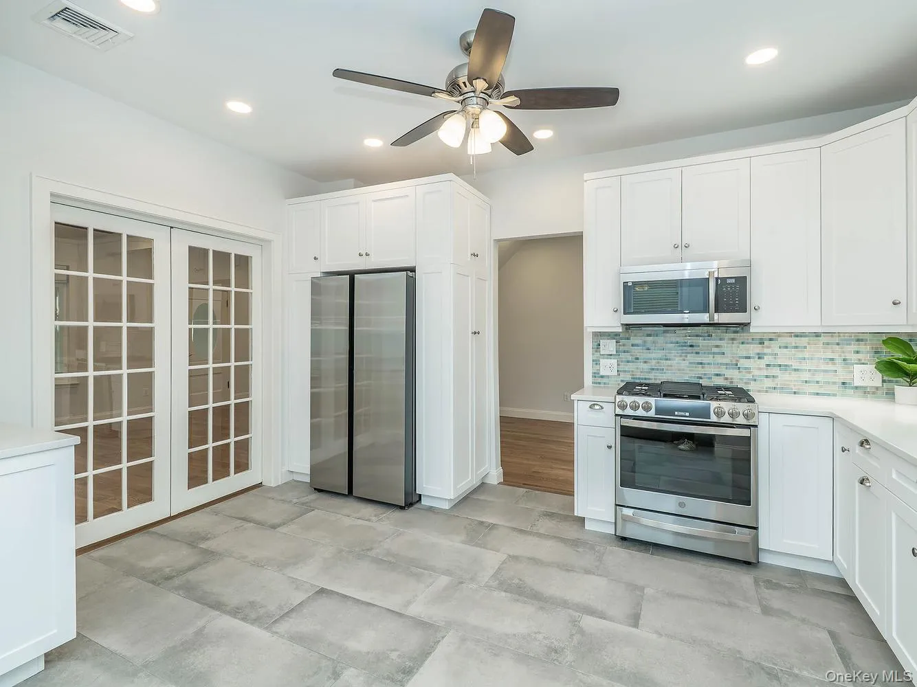 The beautifully renovated eat-in kitchen features modern finishes, new appliances, and a bright, functional layout designed for everyday living and entertaining. The beautifully renovated eat-in kitchen features modern finishes, new appliances, and a bright, functional layout designed for everyday living and entertaining.