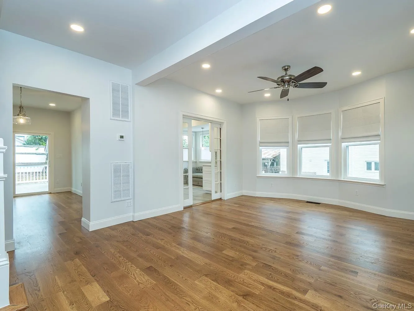 Spacious living room with beautiful bay windows Spacious living room with beautiful bay windows