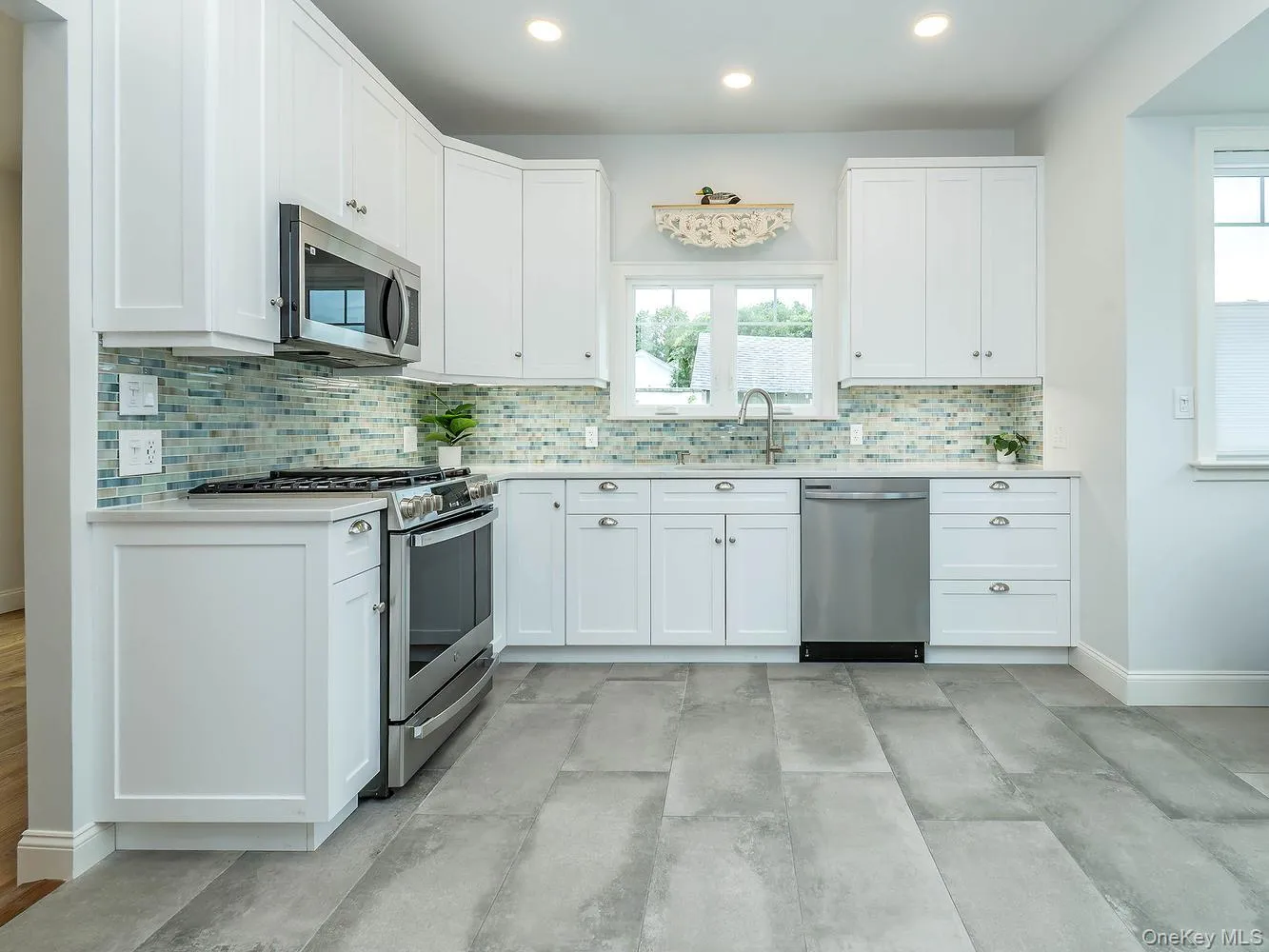 The beautifully renovated eat-in kitchen features modern finishes, new appliances, and a bright, functional layout designed for everyday living and entertaining. The beautifully renovated eat-in kitchen features modern finishes, new appliances, and a bright, functional layout designed for everyday living and entertaining.