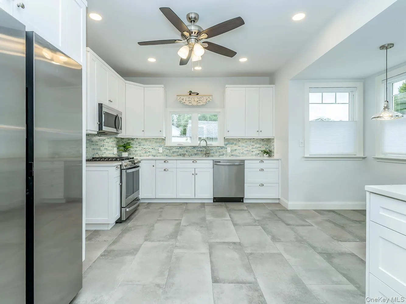 The beautifully renovated eat-in kitchen features modern finishes, new appliances, and a bright, functional layout designed for everyday living and entertaining. The beautifully renovated eat-in kitchen features modern finishes, new appliances, and a bright, functional layout designed for everyday living and entertaining.