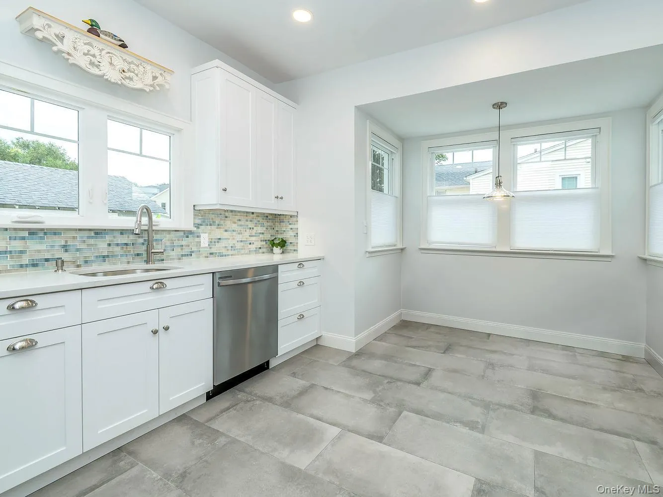 The beautifully renovated eat-in kitchen features modern finishes, new appliances, and a bright, functional layout designed for everyday living and entertaining. The beautifully renovated eat-in kitchen features modern finishes, new appliances, and a bright, functional layout designed for everyday living and entertaining.