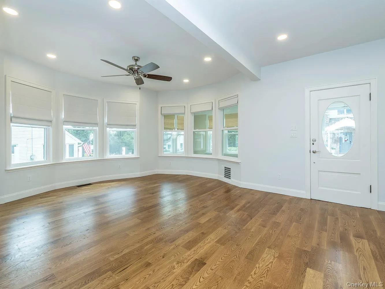 Spacious living room with beautiful bay windows Spacious living room with beautiful bay windows