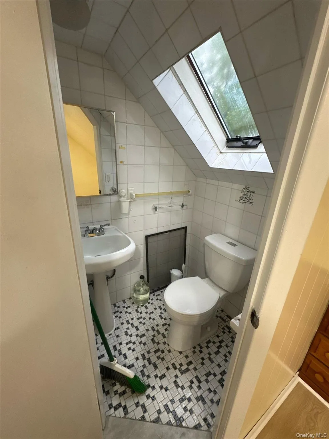 Half bath on second floor with skylight. Half bath on second floor with skylight.