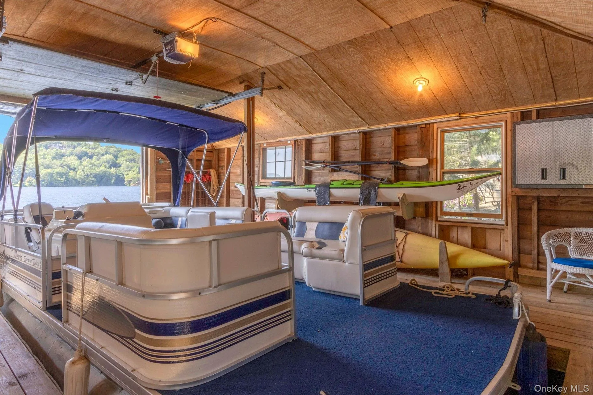 Misc room featuring plenty of natural light, wooden ceiling, wood-type flooring, and vaulted ceiling Misc room featuring plenty of natural light, wooden ceiling, wood-type flooring, and vaulted ceiling