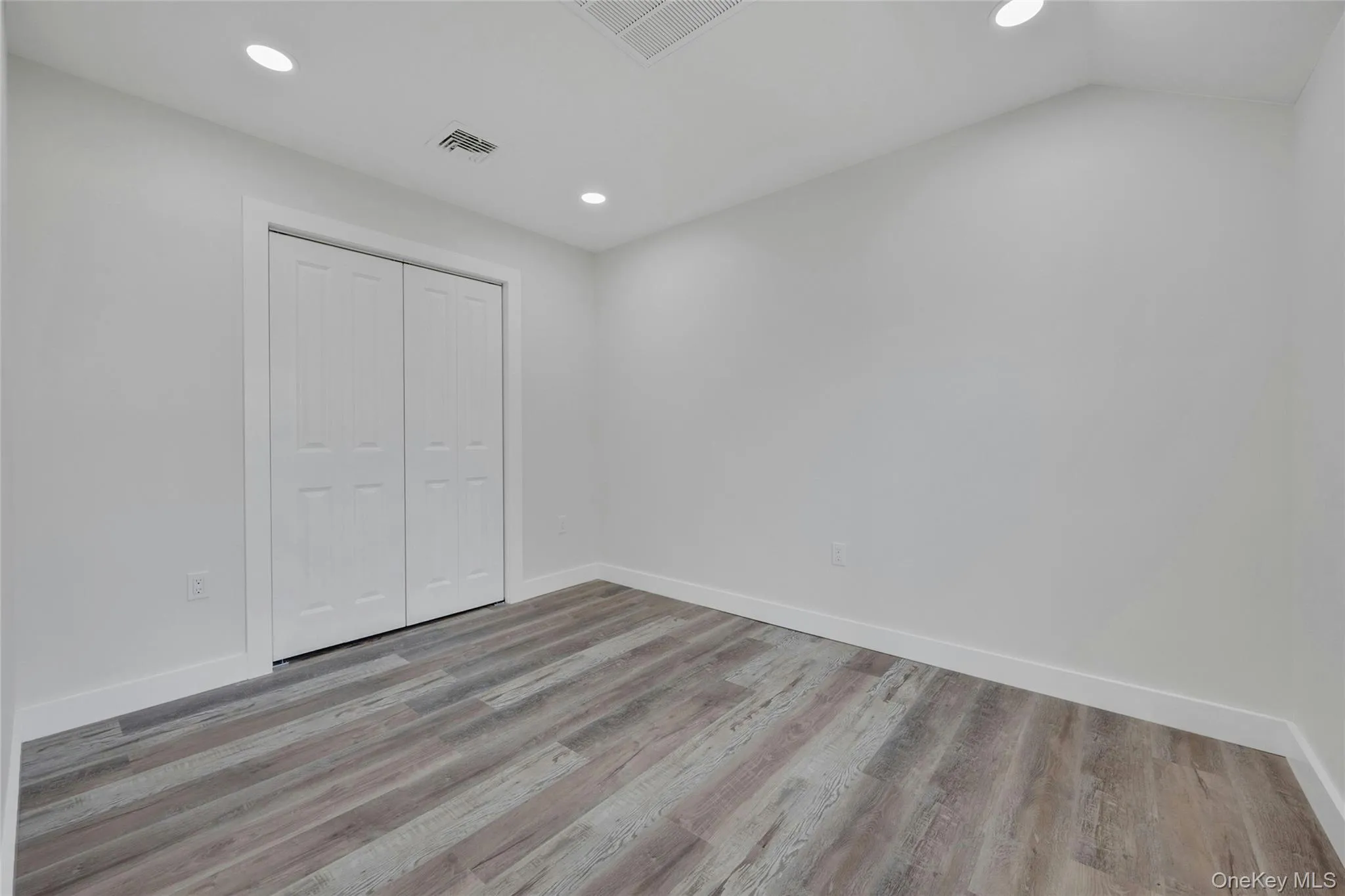 Large bedroom with ample closet space Large bedroom with ample closet space