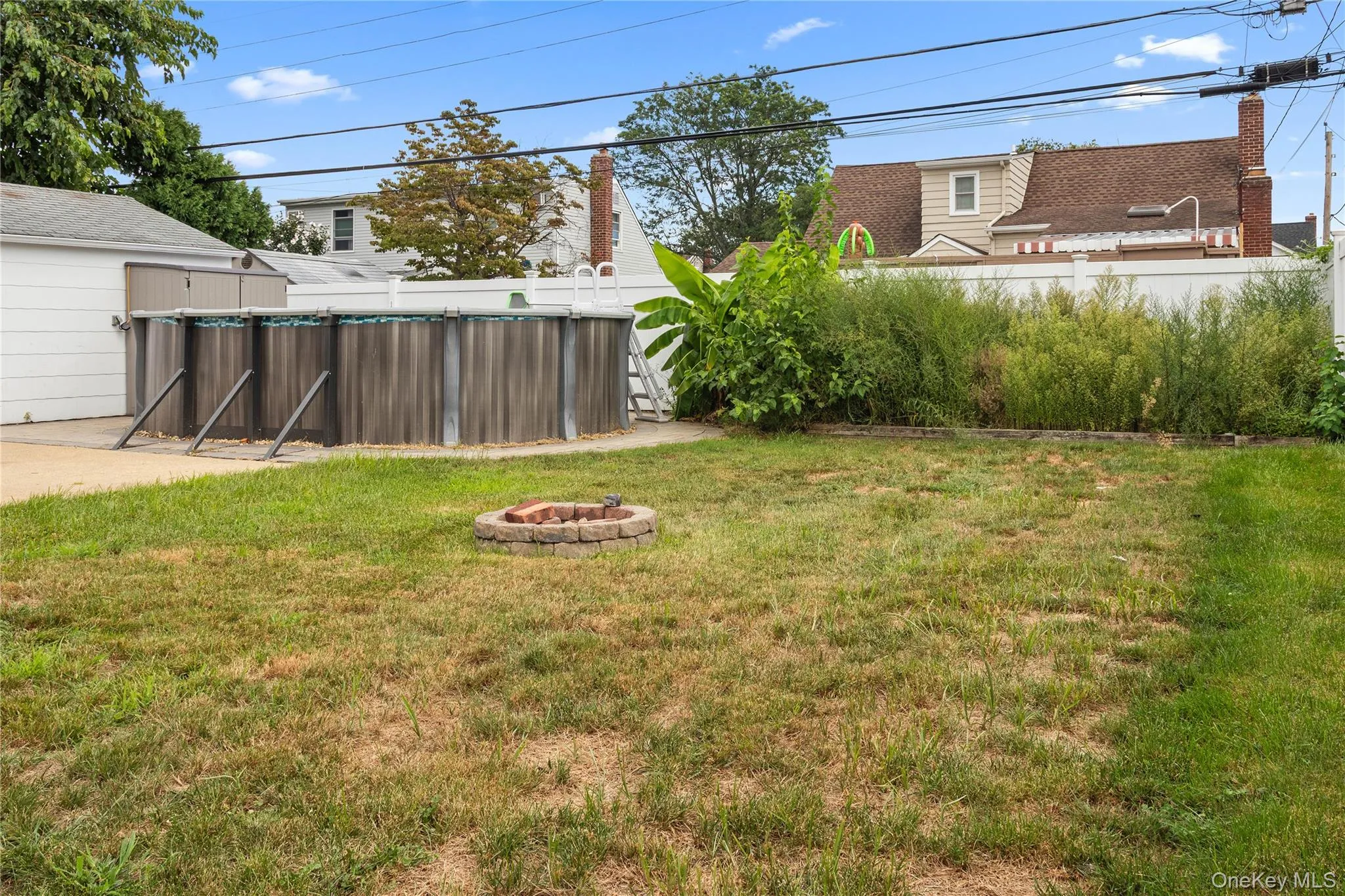 Backyard with open space for entertainment or gardening Backyard with open space for entertainment or gardening