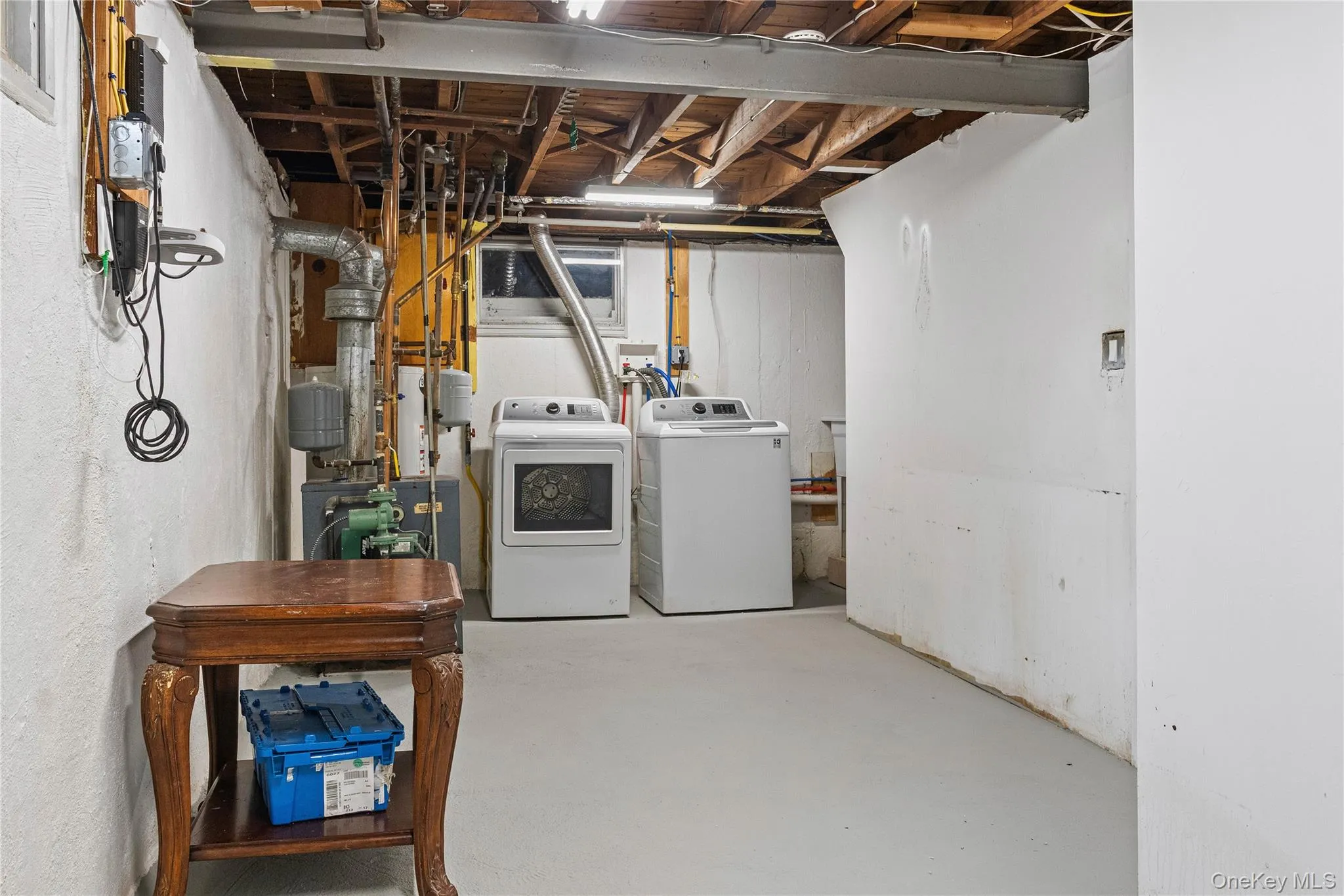 Utility Room with Gas Heating System, Washer, Dryer, Slop Sink, and Storage Utility Room with Gas Heating System, Washer, Dryer, Slop Sink, and Storage