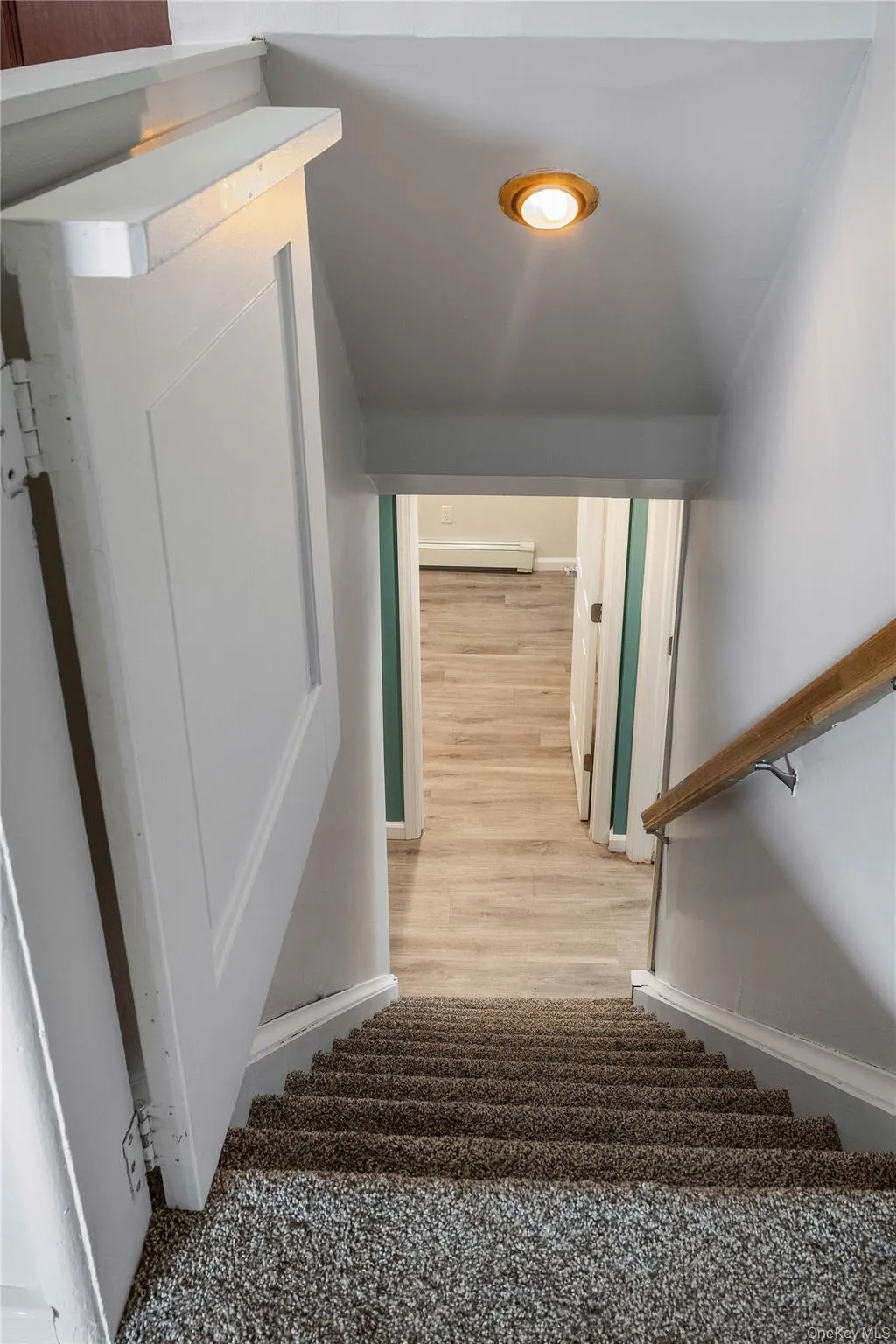 Stairs from Kitchen and Breakfast Area to Basement Entertainment Space and Storage Area Stairs from Kitchen and Breakfast Area to Basement Entertainment Space and Storage Area
