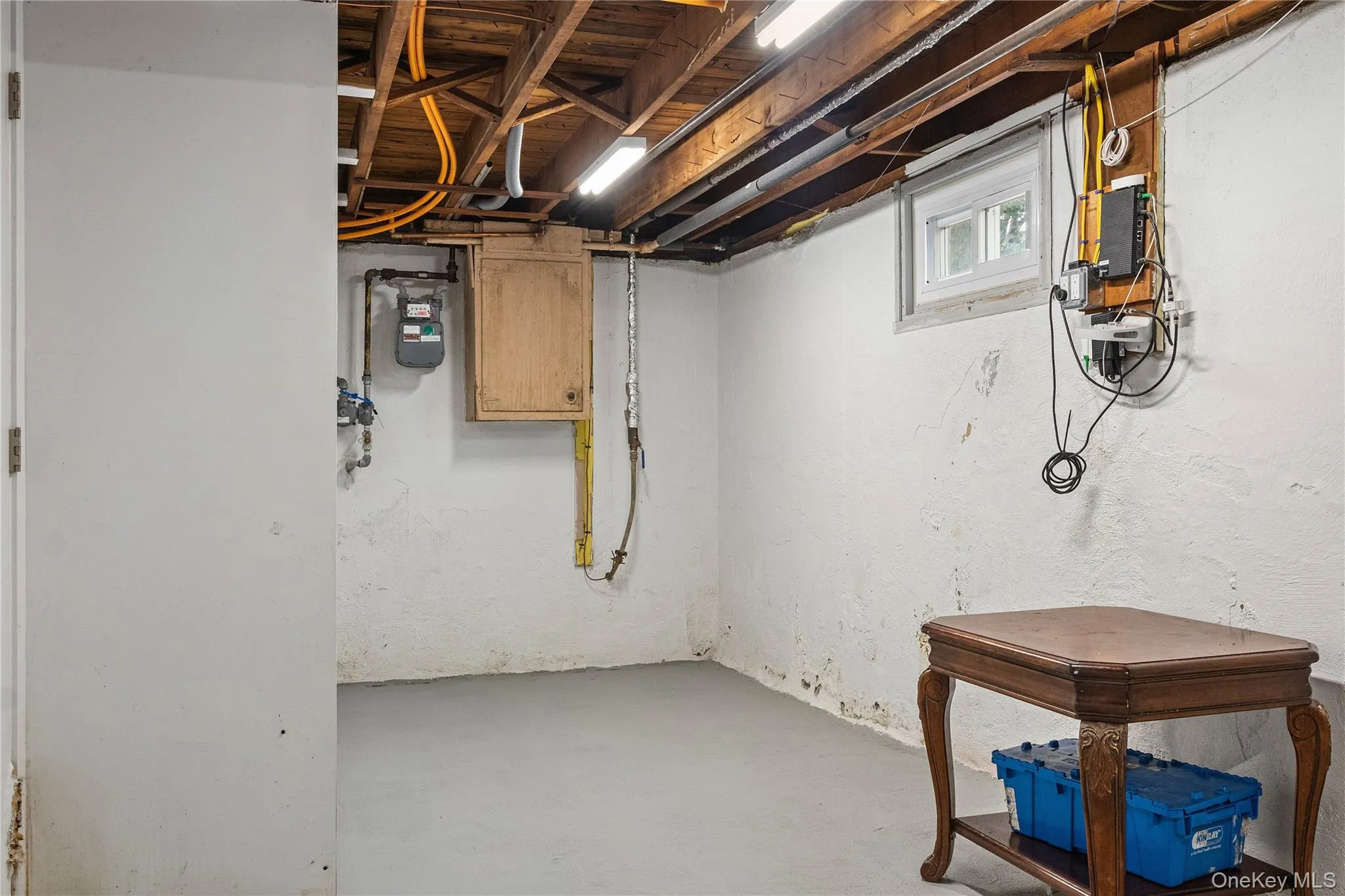 Utility Room with High Ceilings, Gas Meter, and Storage Space Utility Room with High Ceilings, Gas Meter, and Storage Space