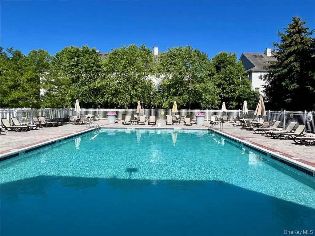 View of swimming pool featuring a patio View of swimming pool featuring a patio