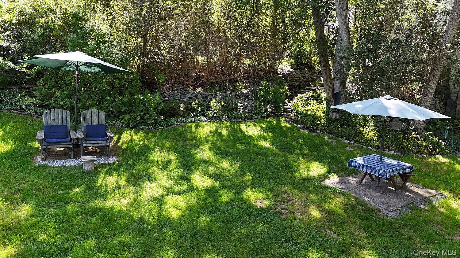 Relax here! Enjoy the yard and lush plantings or just watch the river go by! Relax here! Enjoy the yard and lush plantings or just watch the river go by!
