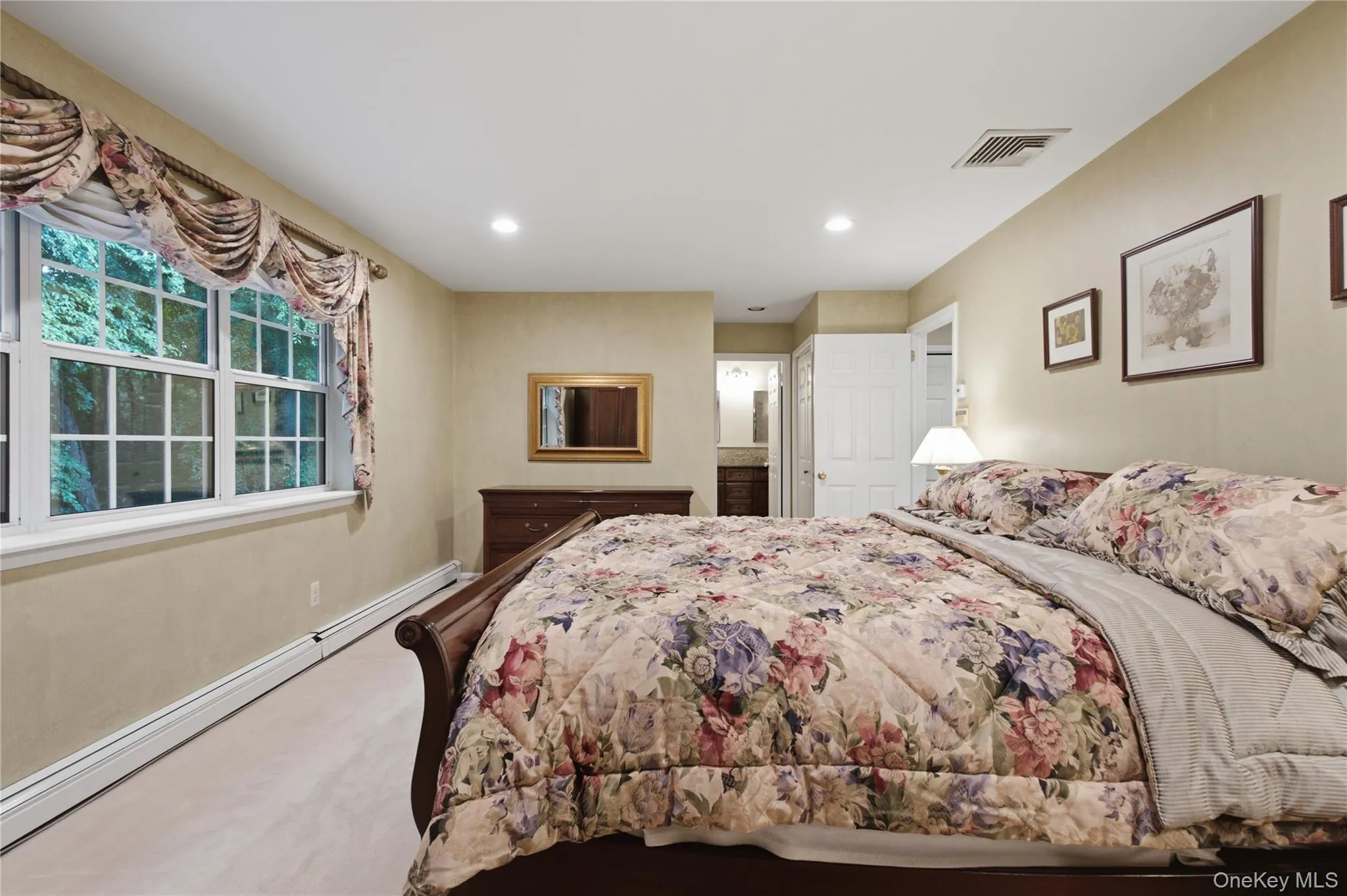 Alternate View of Primary Bedroom. Imagine Living Admist Picturesque Views of Mature Trees from the Privacy of Your Own Bedroom—a Peaceful and Serene Way to Start Each Day. Alternate View of Primary Bedroom. Imagine Living Admist Picturesque Views of Mature Trees from the Privacy of Your Own Bedroom—a Peaceful and Serene Way to Start Each Day.