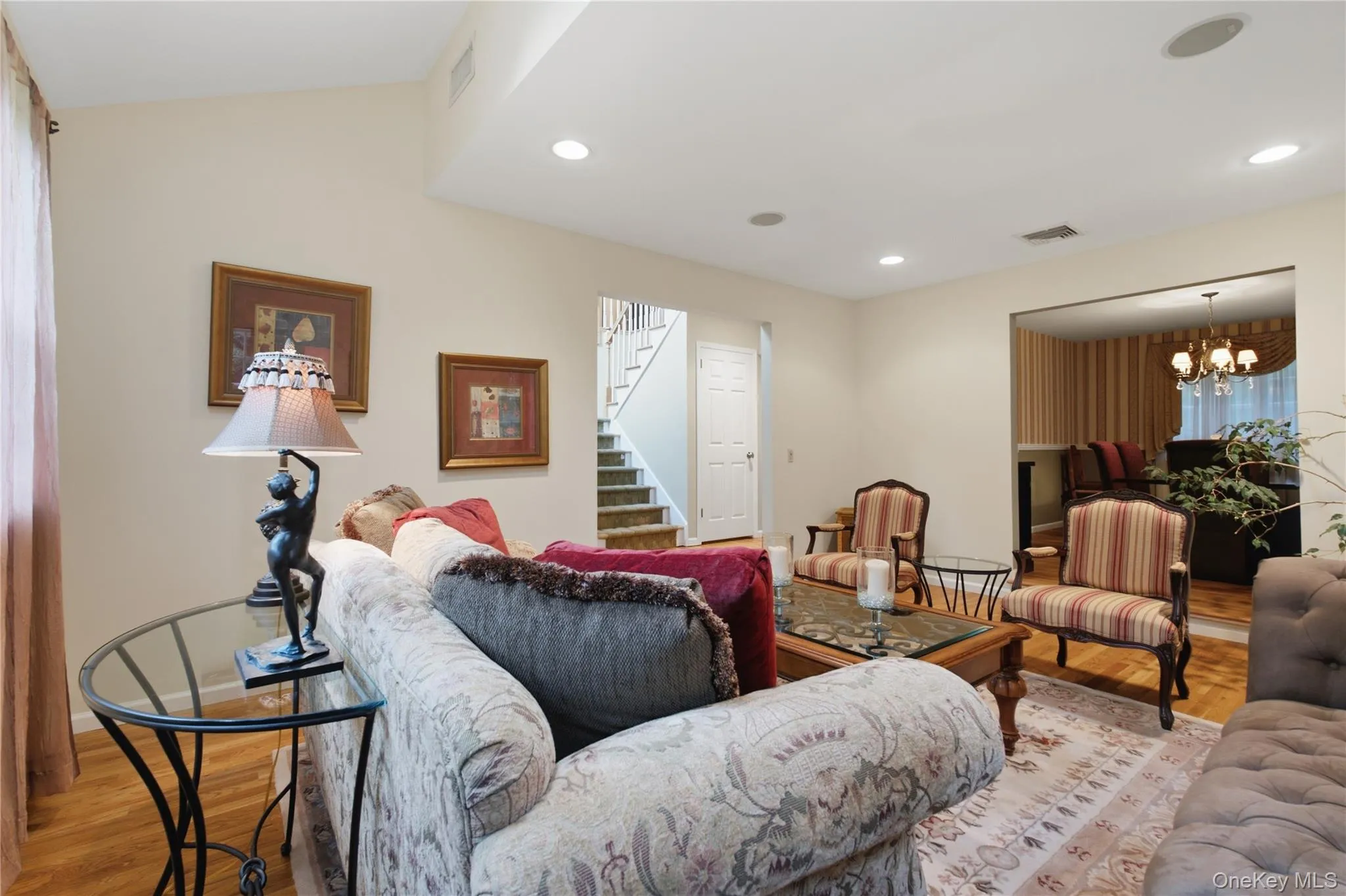 Another View of the Formal Living Room, Highlighting its Seamless Flow from the Dining Room and Dramatic Double-Height Entry Foyer. Another View of the Formal Living Room, Highlighting its Seamless Flow from the Dining Room and Dramatic Double-Height Entry Foyer.
