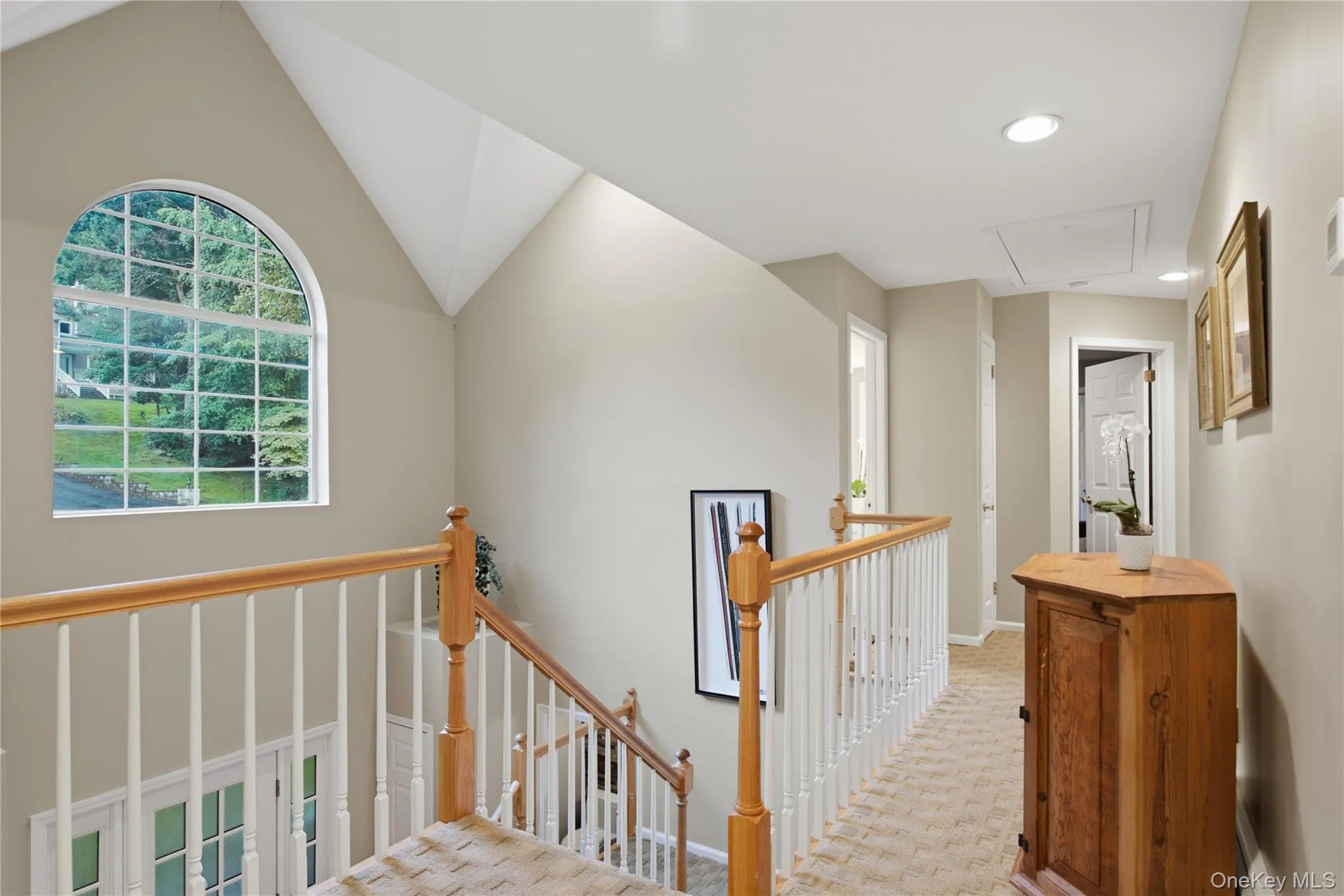 A Gracious Upper Hallway Welcomes You to the Bedroom Level, Filled with Natural Light and Enhanced by Beautiful Cathedral Ceilings. A Gracious Upper Hallway Welcomes You to the Bedroom Level, Filled with Natural Light and Enhanced by Beautiful Cathedral Ceilings.