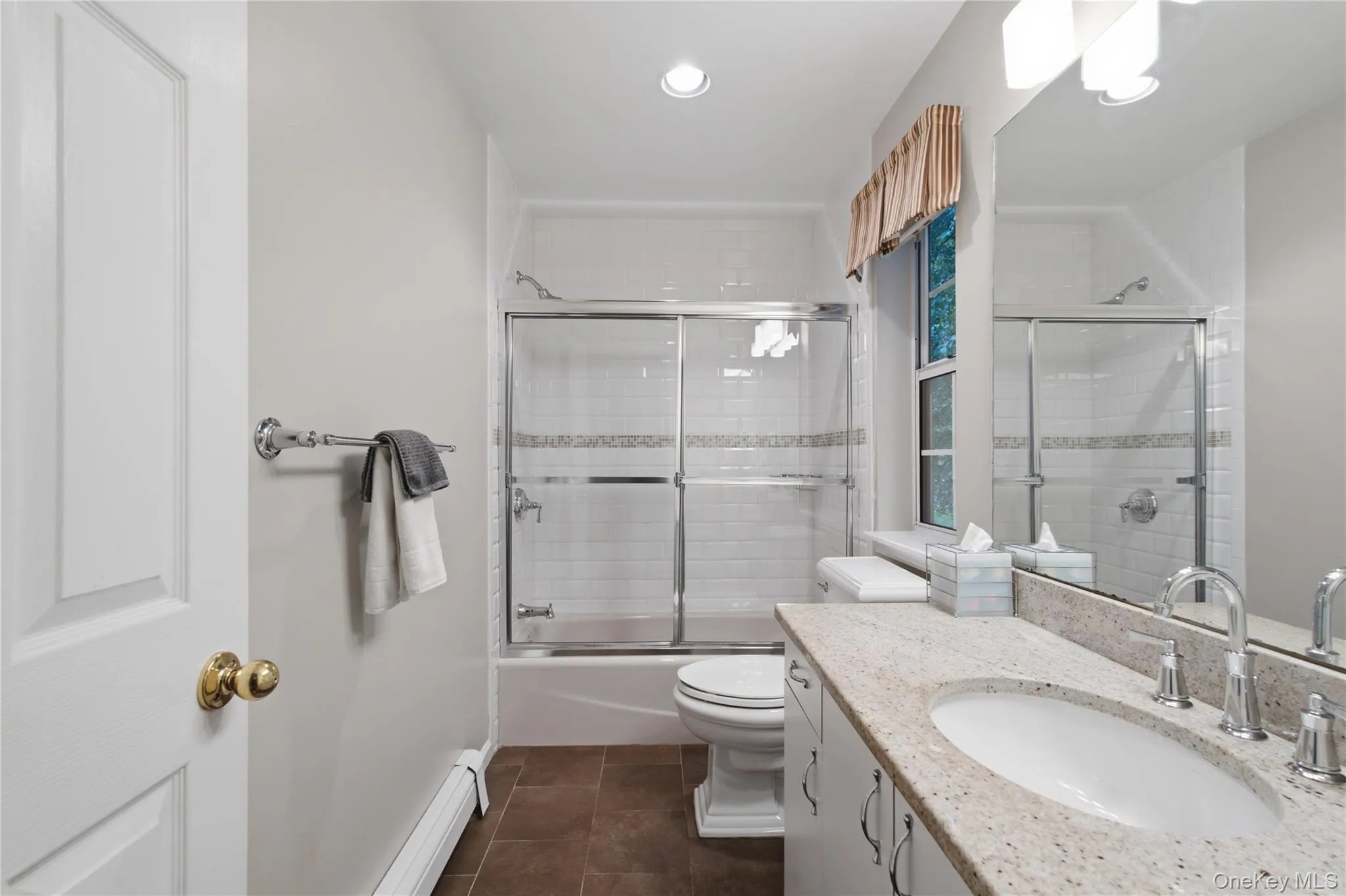Bright and Spacious Updated Hall Bathroom with Stall Shower/Tub Combination Bright and Spacious Updated Hall Bathroom with Stall Shower/Tub Combination
