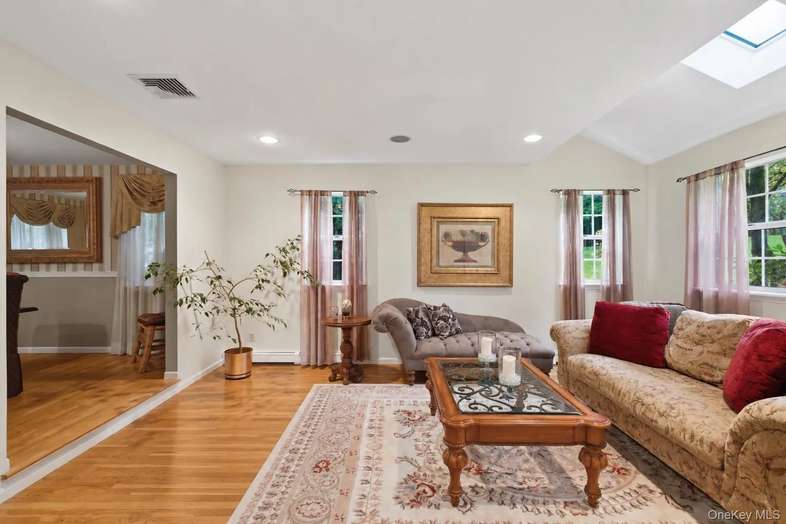 Formal Living Room, Set Just off the Dining Room, Offers an Elegant Additional Space for Entertaining and Gathering. Formal Living Room, Set Just off the Dining Room, Offers an Elegant Additional Space for Entertaining and Gathering.