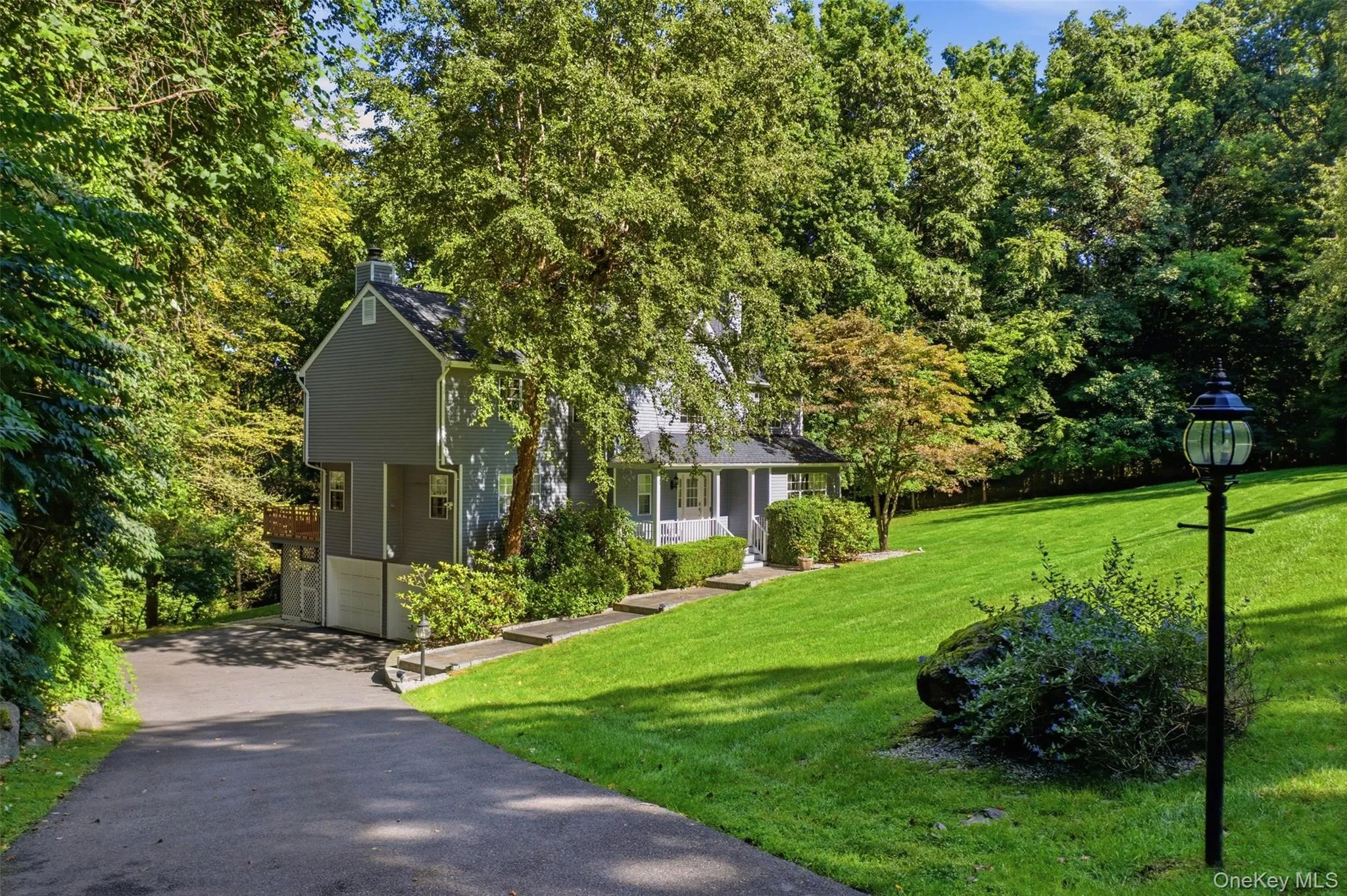 Set on nearly 1 acre, and tucked on a cul de sac, this impressive property is approached by a long, private driveway, complemented by a spacious 2-car garage. Set on nearly 1 acre, and tucked on a cul de sac, this impressive property is approached by a long, private driveway, complemented by a spacious 2-car garage.