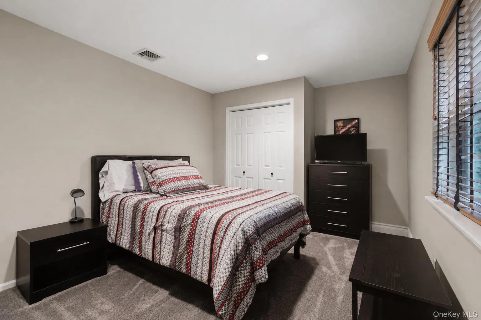 2nd Bedroom with Hardwood Flooring Beneath the Existing Carpeting. 2nd Bedroom with Hardwood Flooring Beneath the Existing Carpeting.