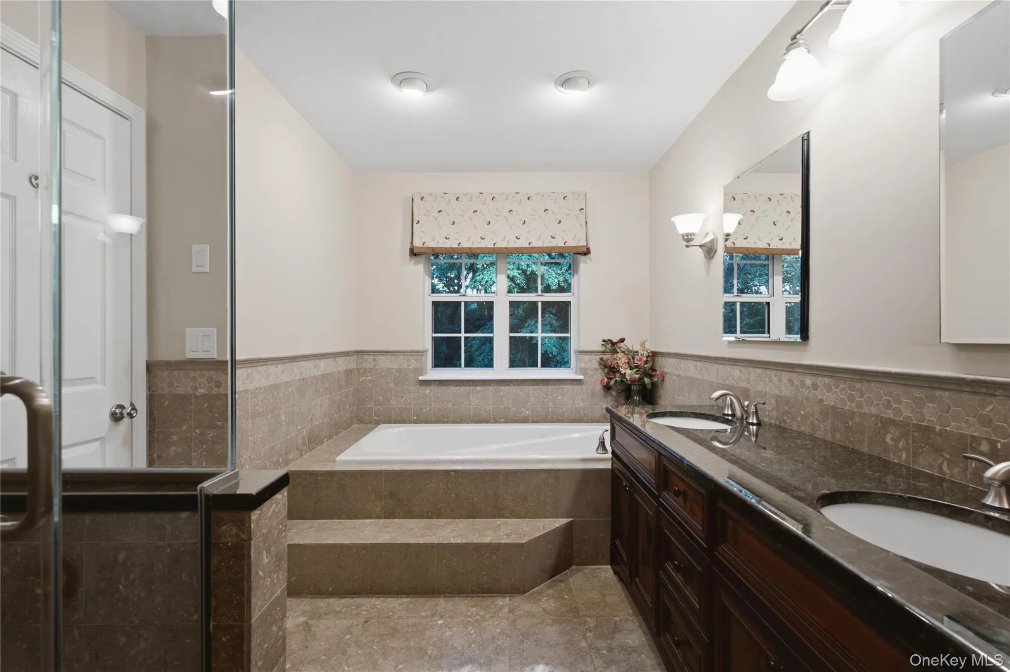 Alternate View of the Primary Ensuite Bathroom Soaking Tub, and Double Sinks. Alternate View of the Primary Ensuite Bathroom Soaking Tub, and Double Sinks.