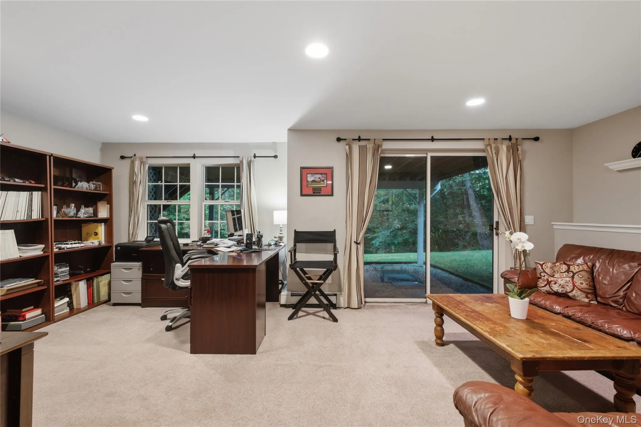 Spacious and Flexible Space, Currently Being used as a Home Office and Recreation Area, with Sliding Glass Doors Leading to the Backyard. Spacious and Flexible Space, Currently Being used as a Home Office and Recreation Area, with Sliding Glass Doors Leading to the Backyard.