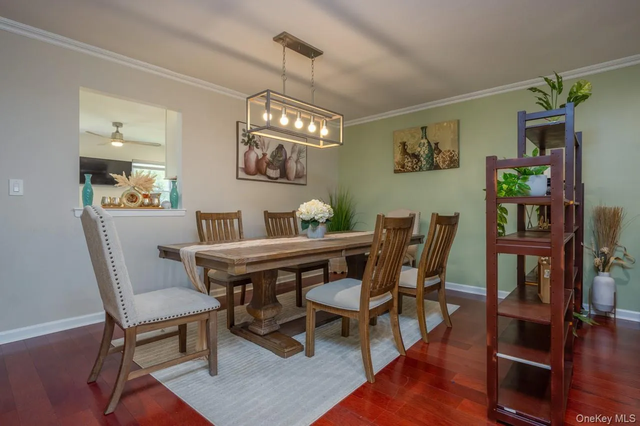 Beautiful dining room with room for all and a pass through to the kitchen for easy serving. Beautiful dining room with room for all and a pass through to the kitchen for easy serving.