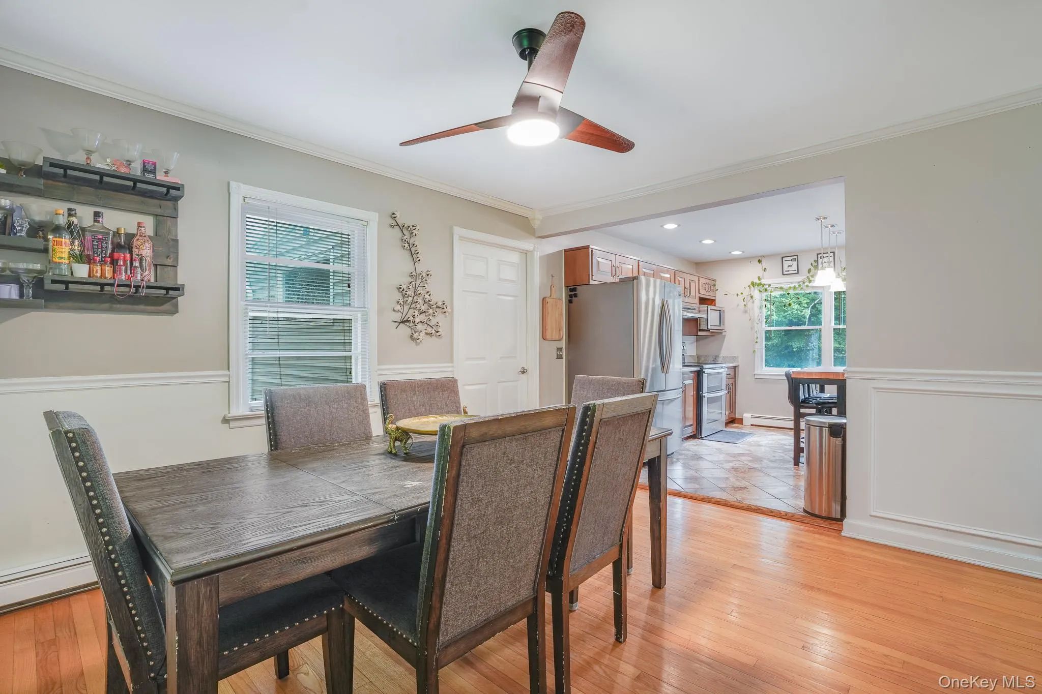 Formal dining room with an open concept to the kitchen. Formal dining room with an open concept to the kitchen.