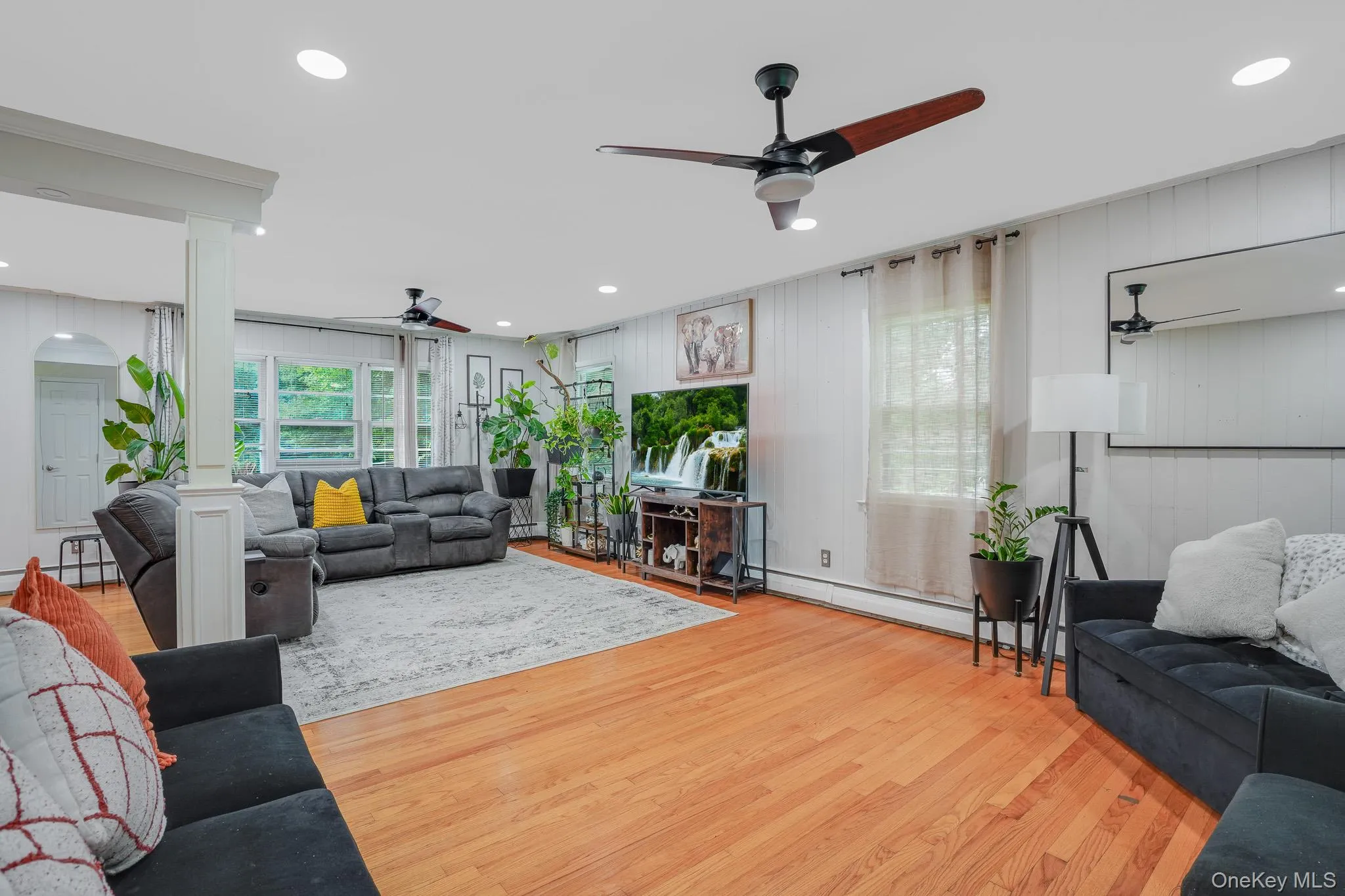 Large living room with multiple windows. Large living room with multiple windows.