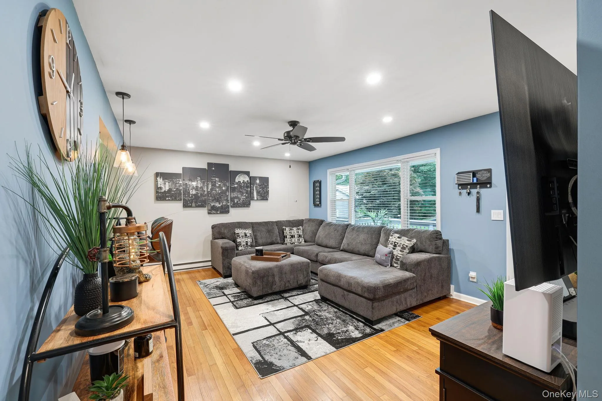 Living Room with Hardwood Floors, Ceiling Fan, Recessed Lights Living Room with Hardwood Floors, Ceiling Fan, Recessed Lights