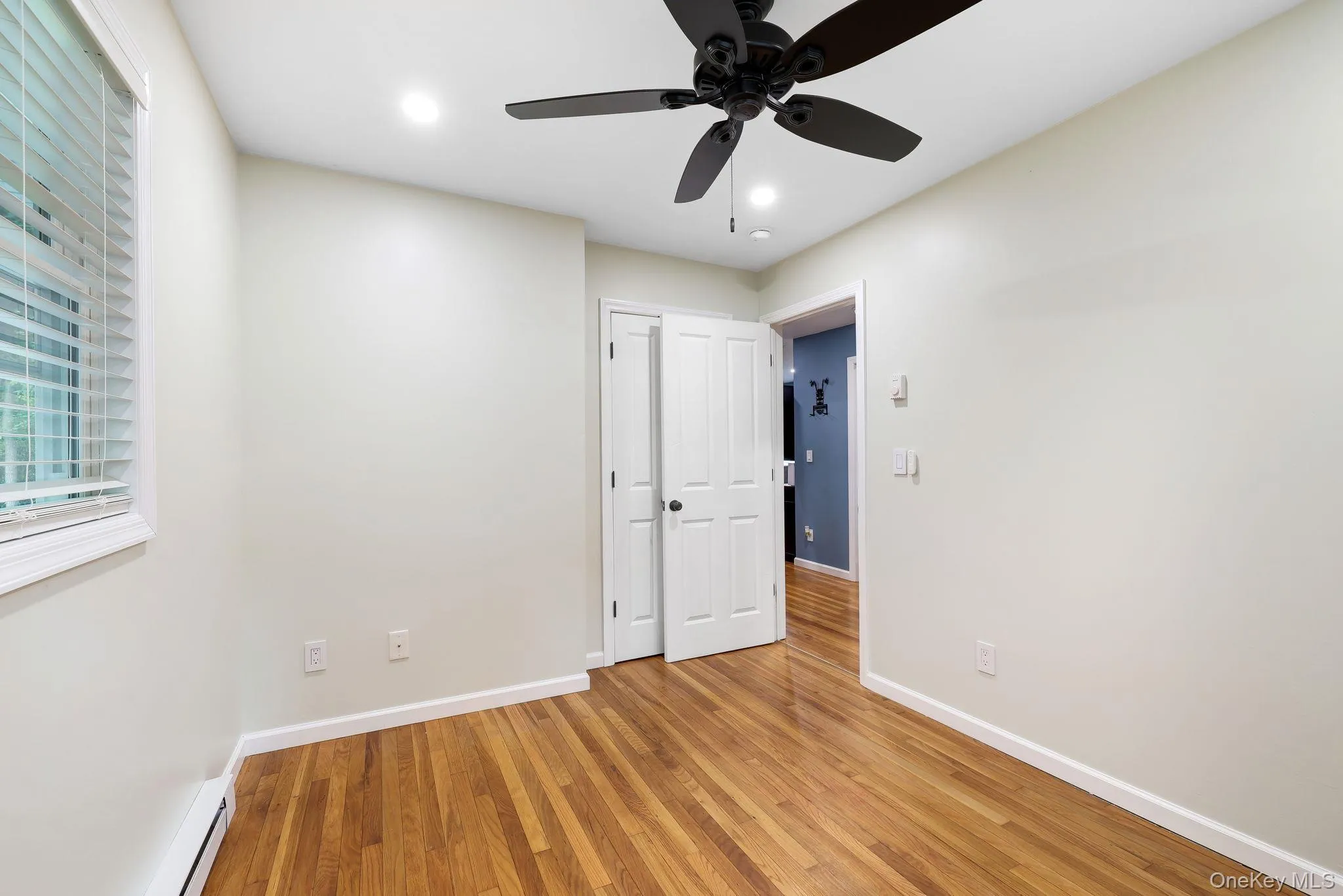 Second Bedroom with Hardwood Floor, Ceiling Fan and Recessed Lights Second Bedroom with Hardwood Floor, Ceiling Fan and Recessed Lights