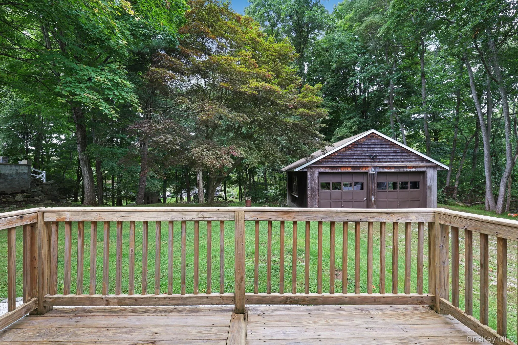 Back Deck leading to Back Yard and Oversized Two Car Garage Back Deck leading to Back Yard and Oversized Two Car Garage