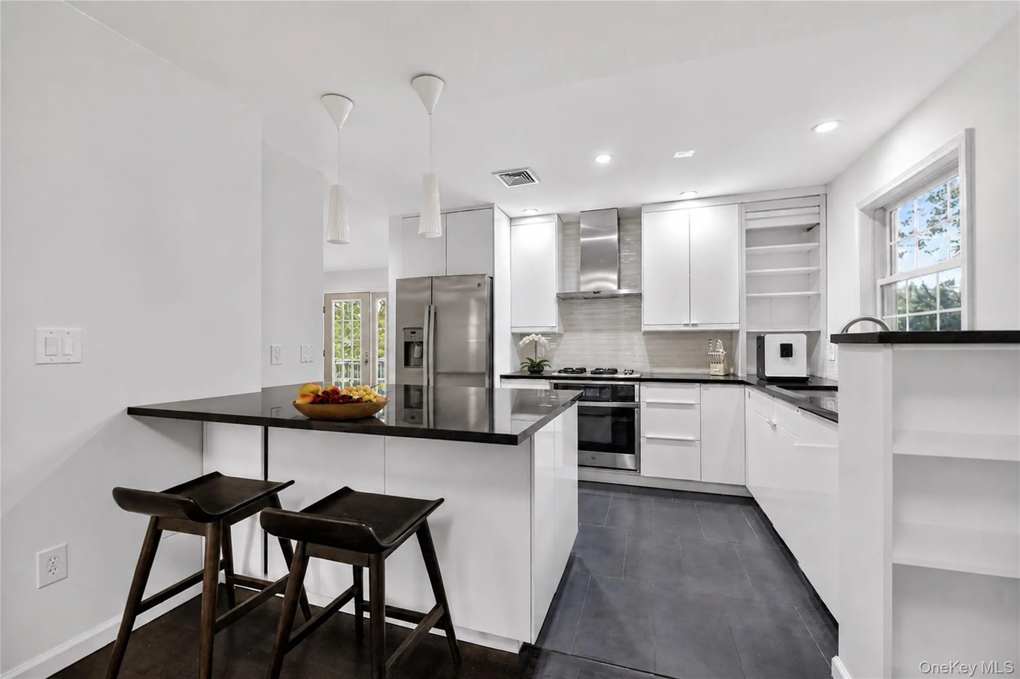 Kitchen island with breakfast area. Kitchen island with breakfast area.