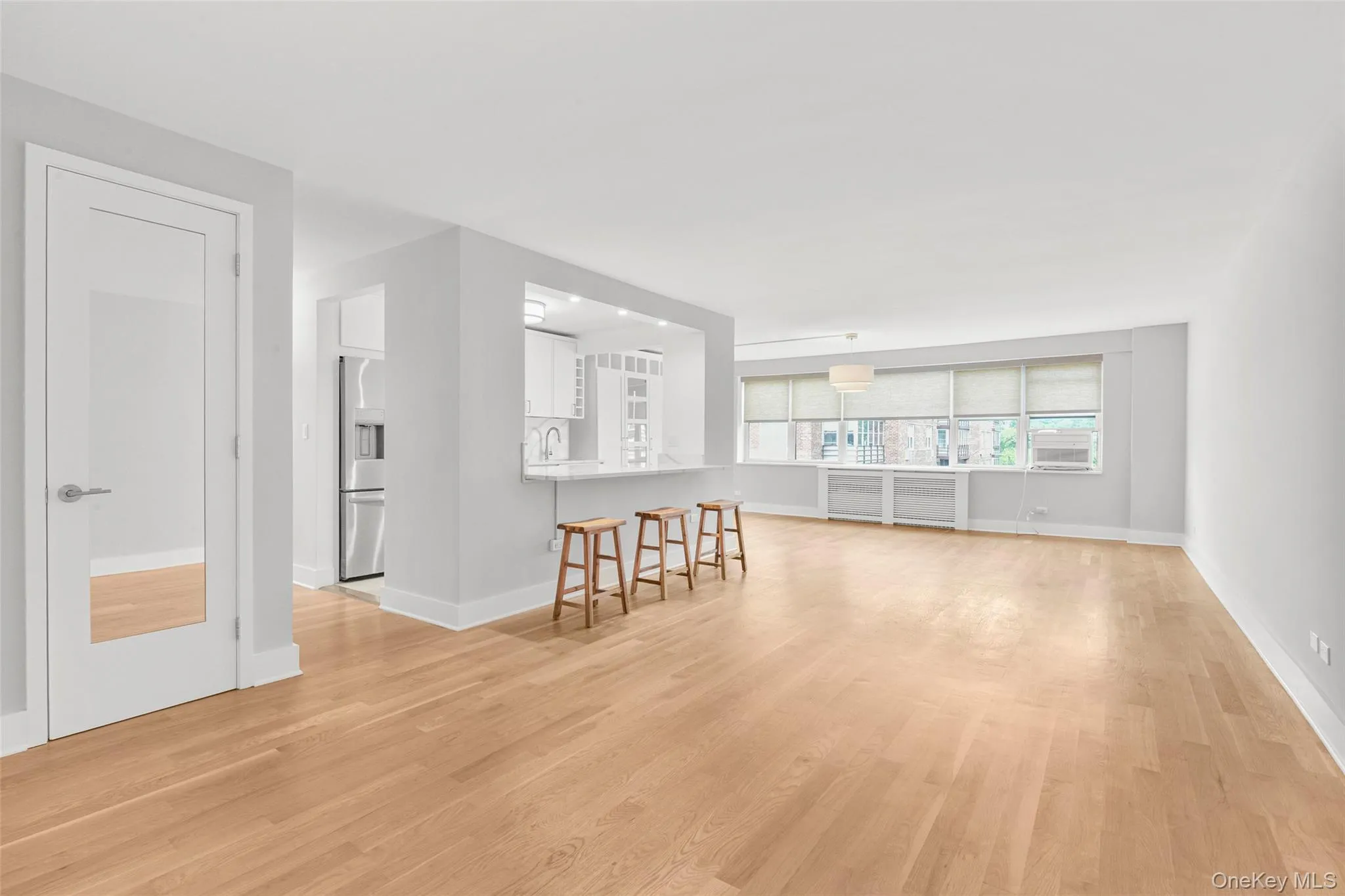 White oak hardwood flooring throughout open concept living space White oak hardwood flooring throughout open concept living space