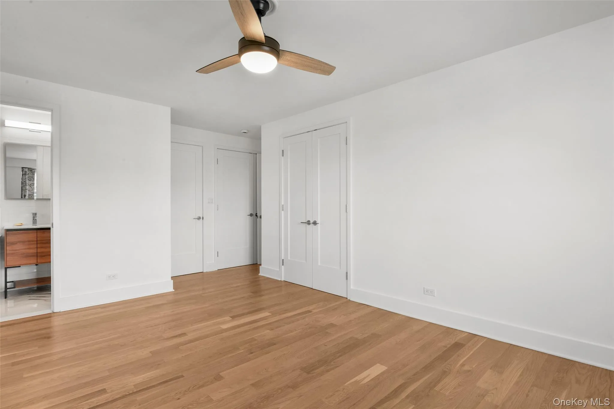 Primary bedroom, featuring two double-door closets, ensuite bathroom and space for stackable Washer/Dryer unit Primary bedroom, featuring two double-door closets, ensuite bathroom and space for stackable Washer/Dryer unit