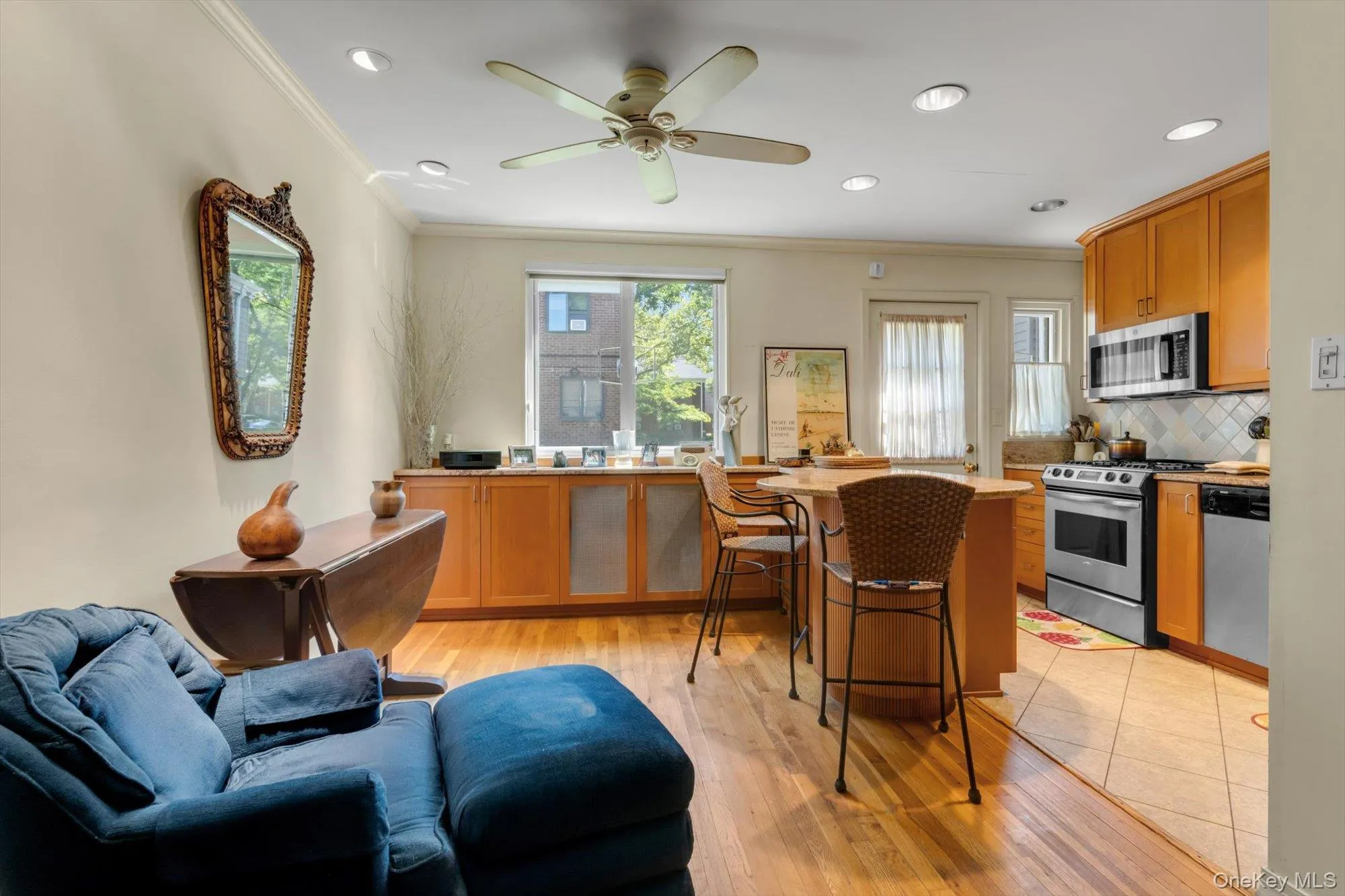 Dining Area + Kitchen with a breakfast bar/peninsula with seating. Dining Area + Kitchen with a breakfast bar/peninsula with seating.