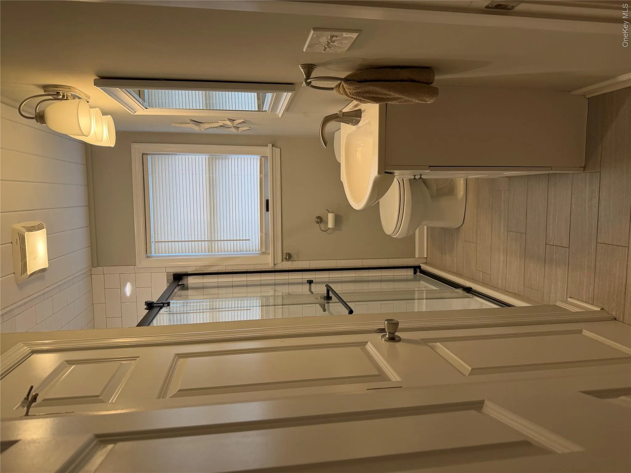 Updated bathroom with linen closet Updated bathroom with linen closet