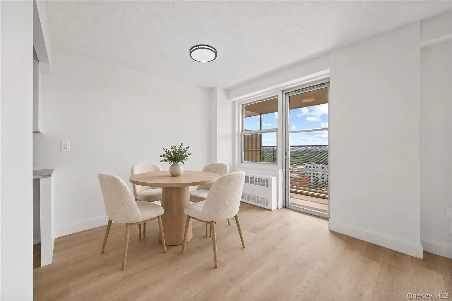 Vinyl flooring, white walls, and a sliding glass door to an exterior balcony Vinyl flooring, white walls, and a sliding glass door to an exterior balcony