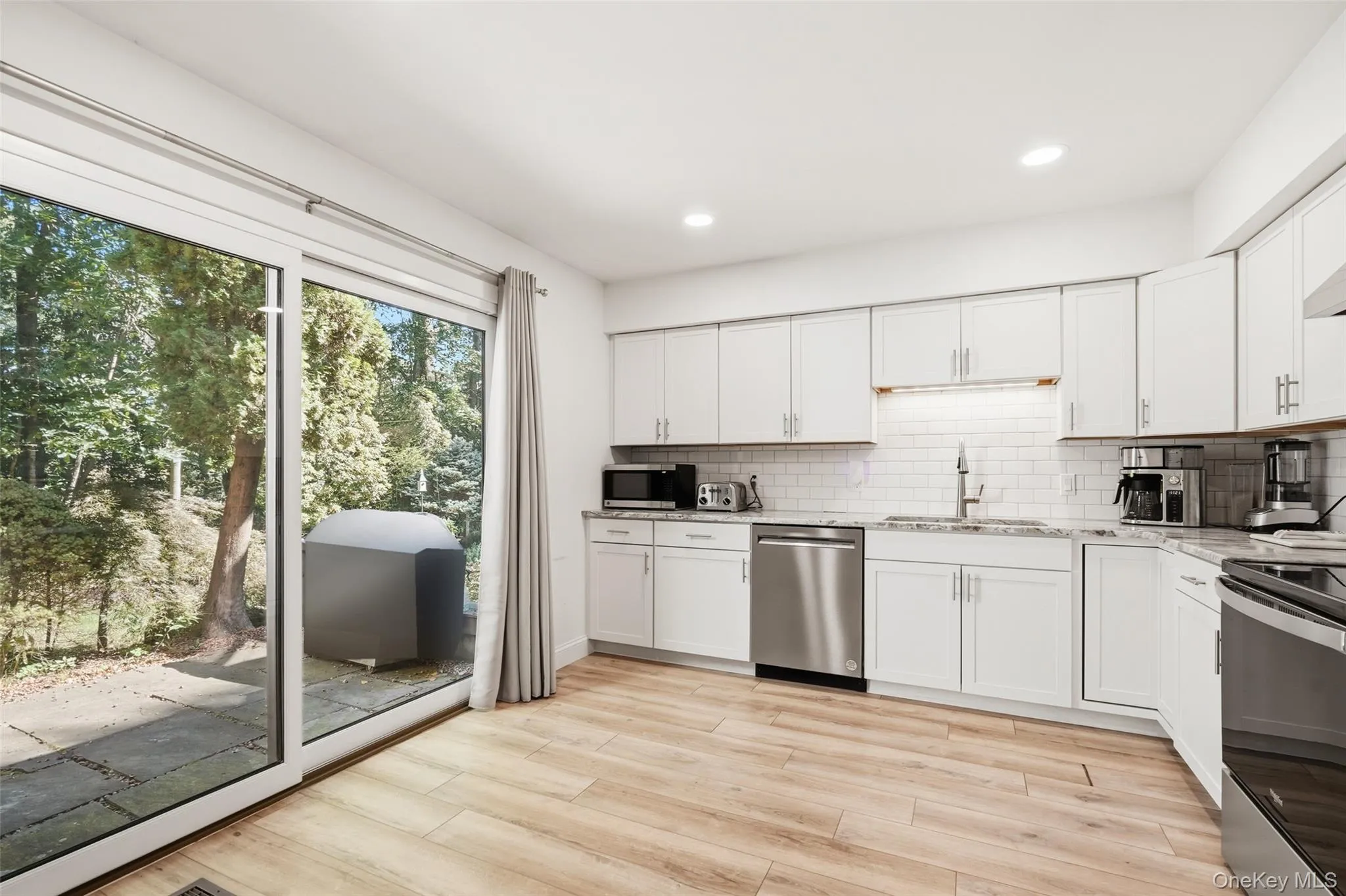Renovated Eat-in Kitchen with Glass Doors to Patio Renovated Eat-in Kitchen with Glass Doors to Patio