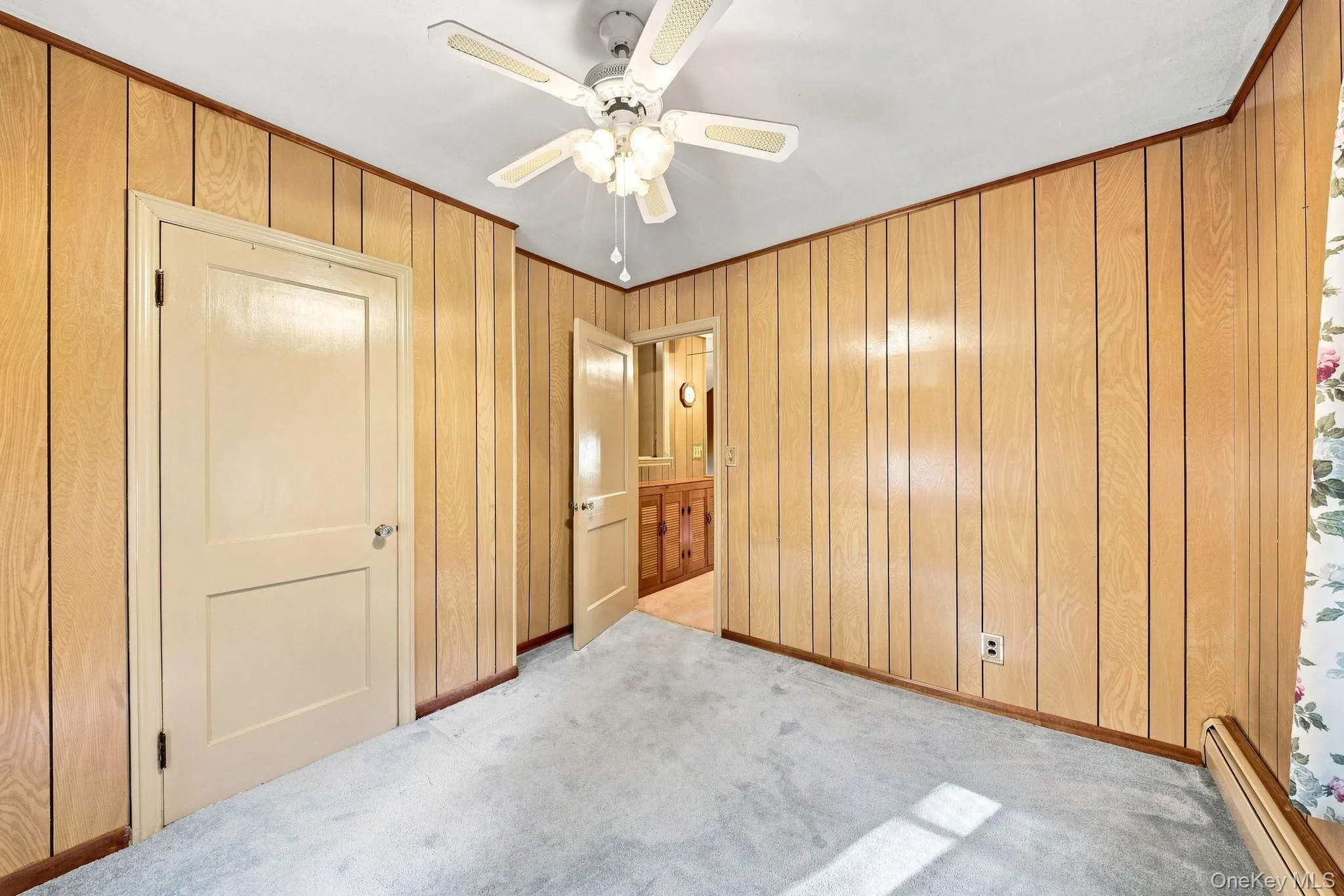 paneled walls, wall to wall carpet like new, ceiling fan/light paneled walls, wall to wall carpet like new, ceiling fan/light